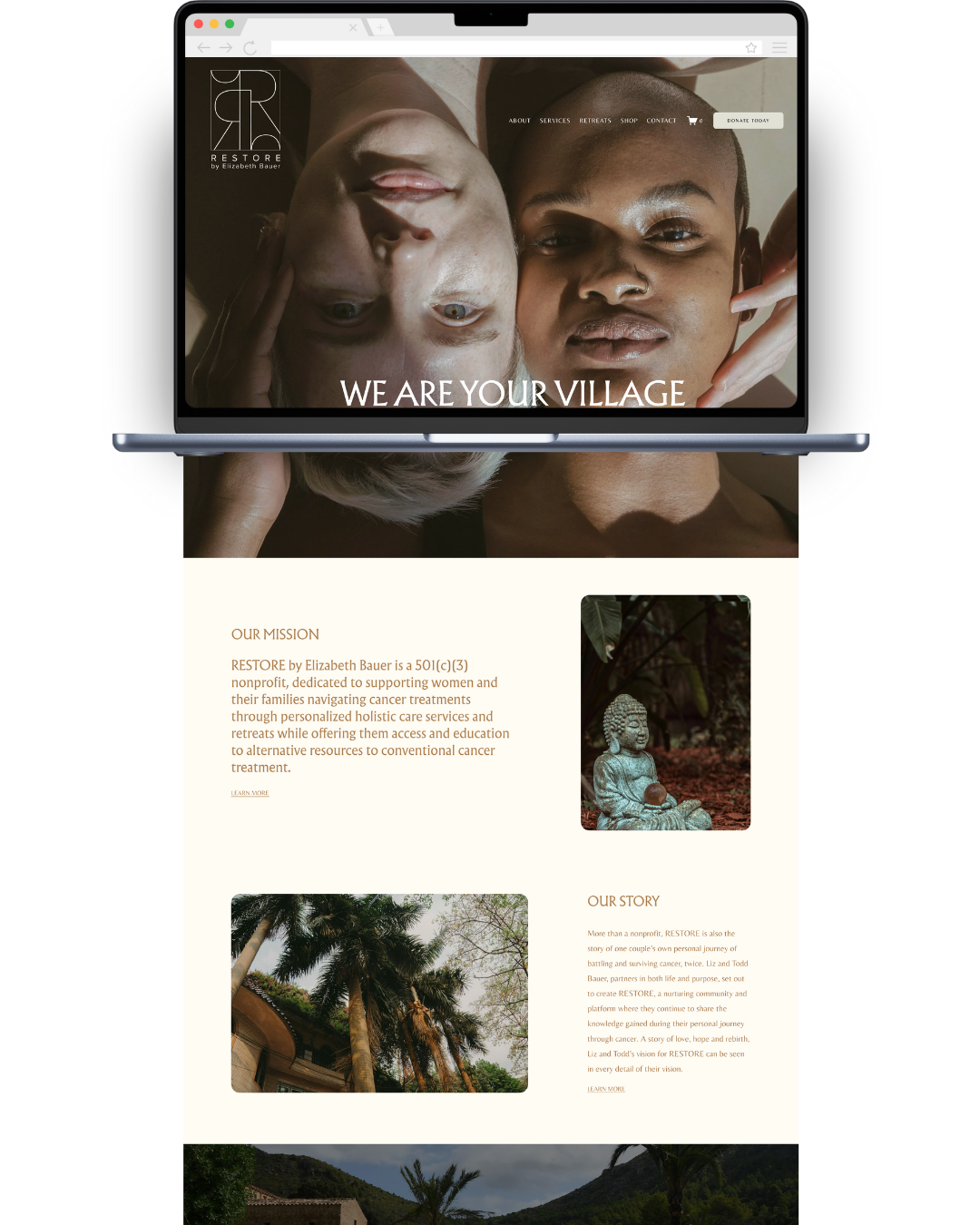 A laptop displaying a website for a nonprofit organization called RESTORE, founded by Elizabeth Bauer. The website features a large header image showing two women, one with light skin and the other with dark skin, lying down with their heads close together. The headline text states, "WE ARE YOUR VILLAGE." Below the header, there are sections with images and text describing the organization's mission and story, including a small photo of a Buddha statue and scenic outdoor images of trees and landscapes.