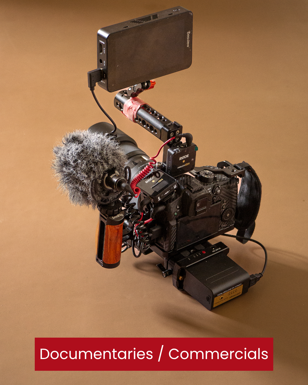 Professional video camera setup with microphone, monitor, and accessories on a neutral background, labeled 'Documentaries / Commercials'. Lumix gh5. Smallrig Cage. Rode microphone. Video Monitor. Professional cinema camera setup in Donegal.