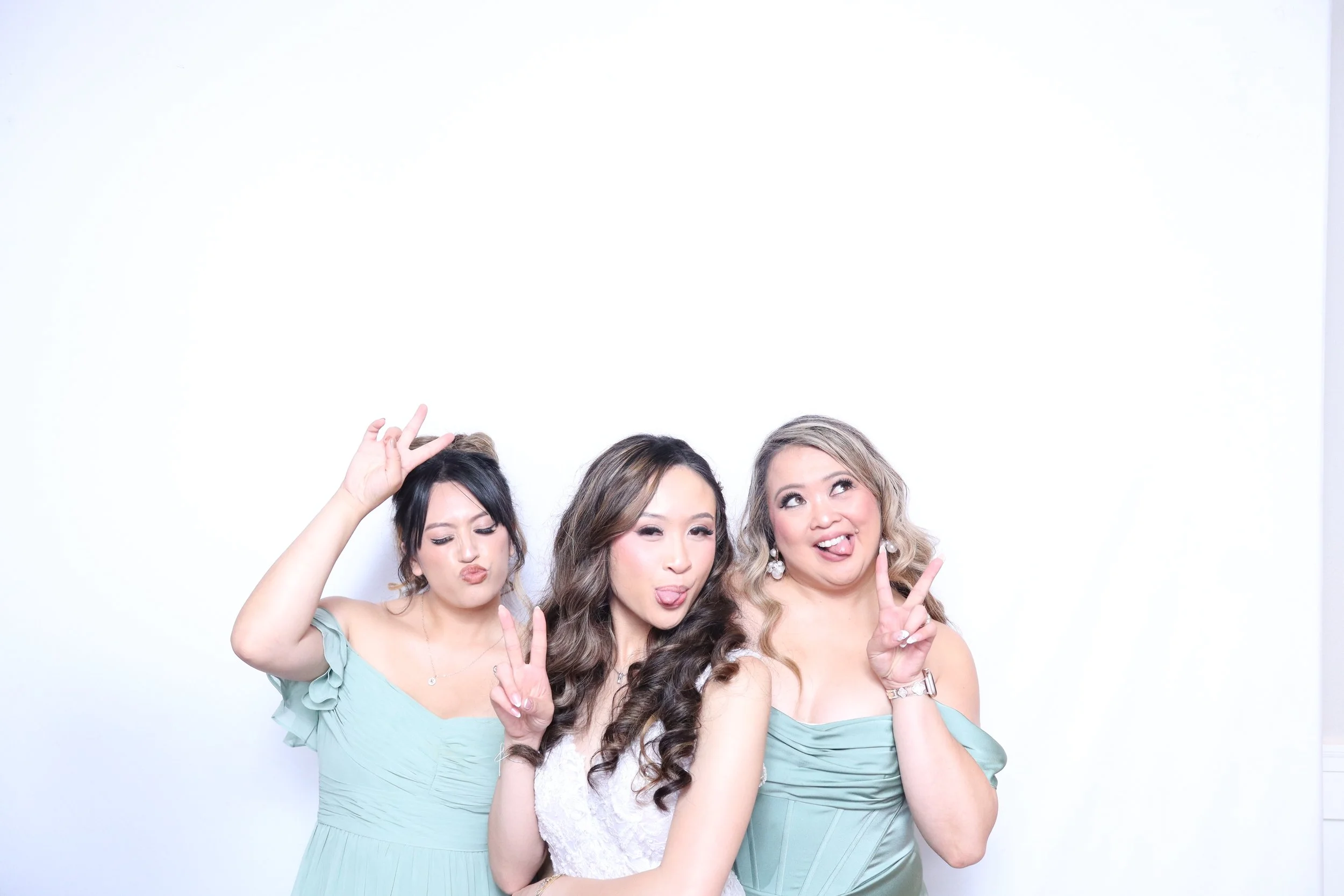 Photo of bride and her bridesmaids using studio photo booth in issaquah