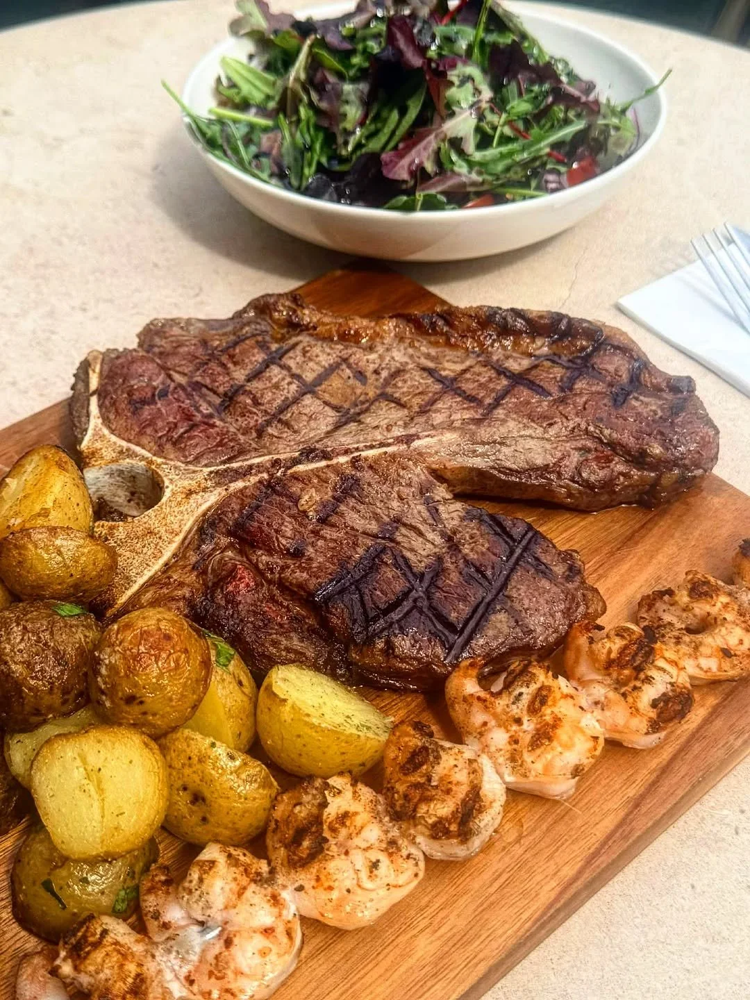 Our new special available from today! SURF N TURF for 2. A 600g T-Bone with grilled King Prawns, saut&eacute;ed potatoes and salad. &pound;78 for 2. #surfnturf #tbone #wandsworthbridgeroad #joesbrasserie #fulhamrestaurants