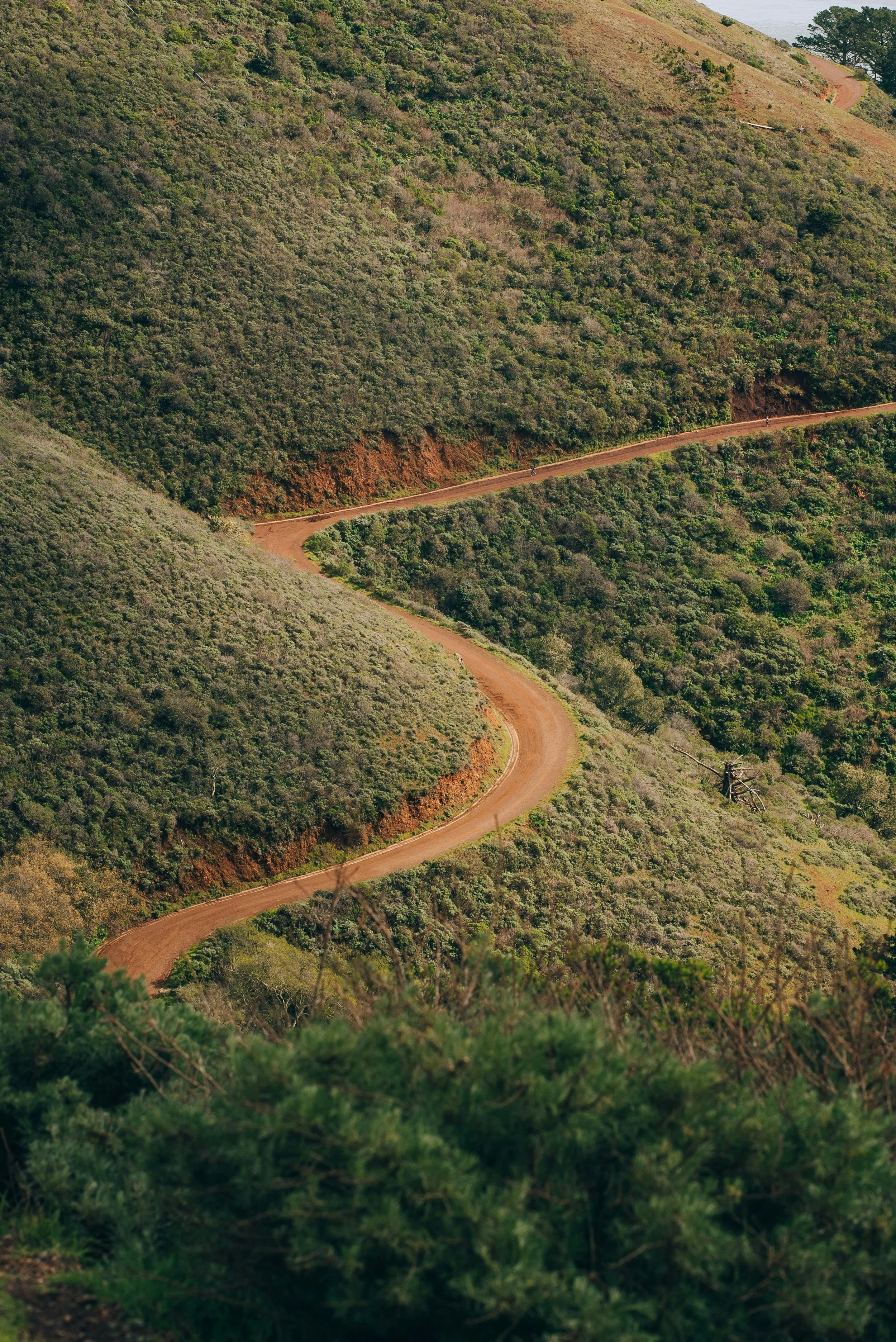 Winding dirt road through a mountain 