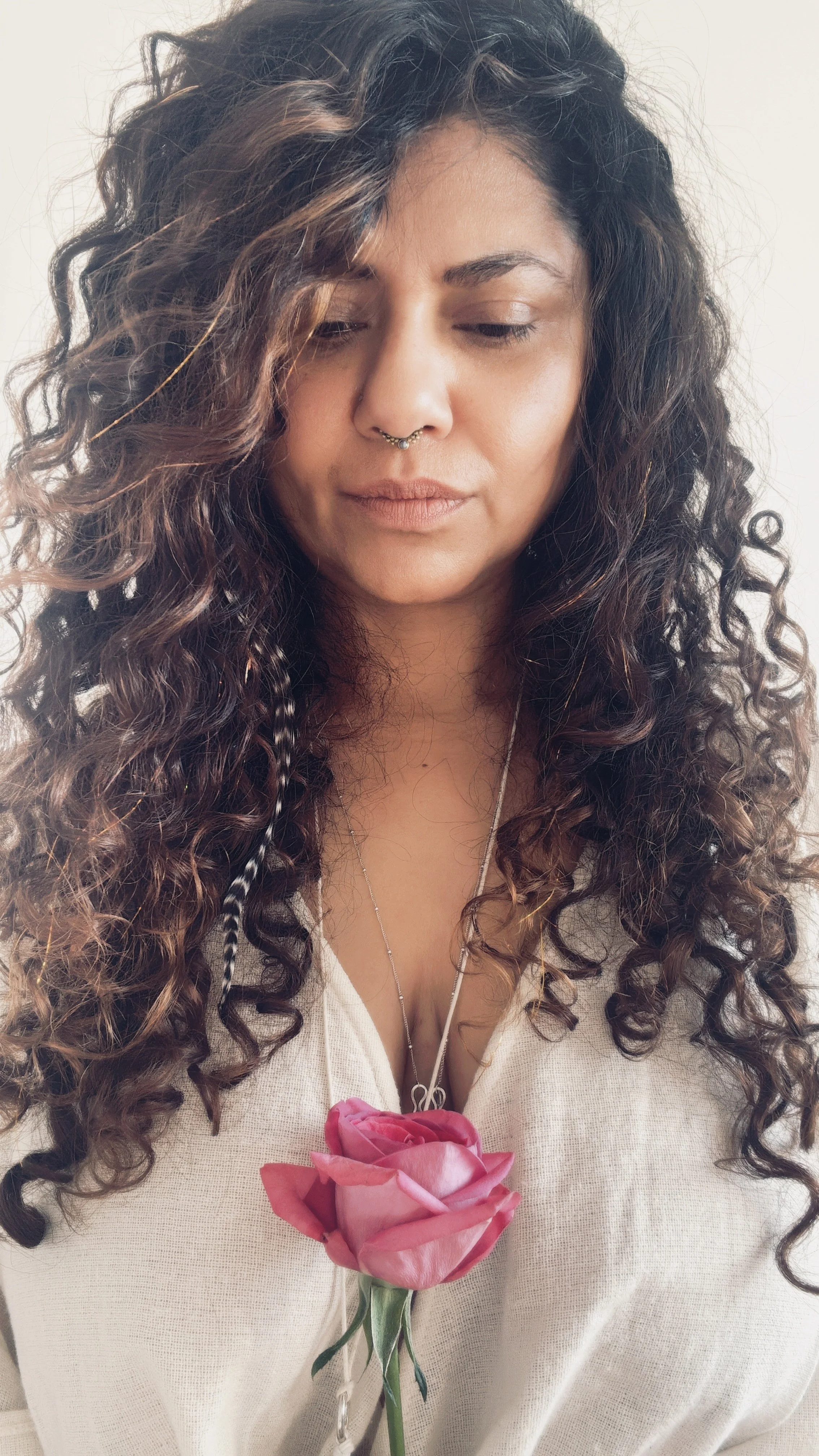Woman holding a pink rose
