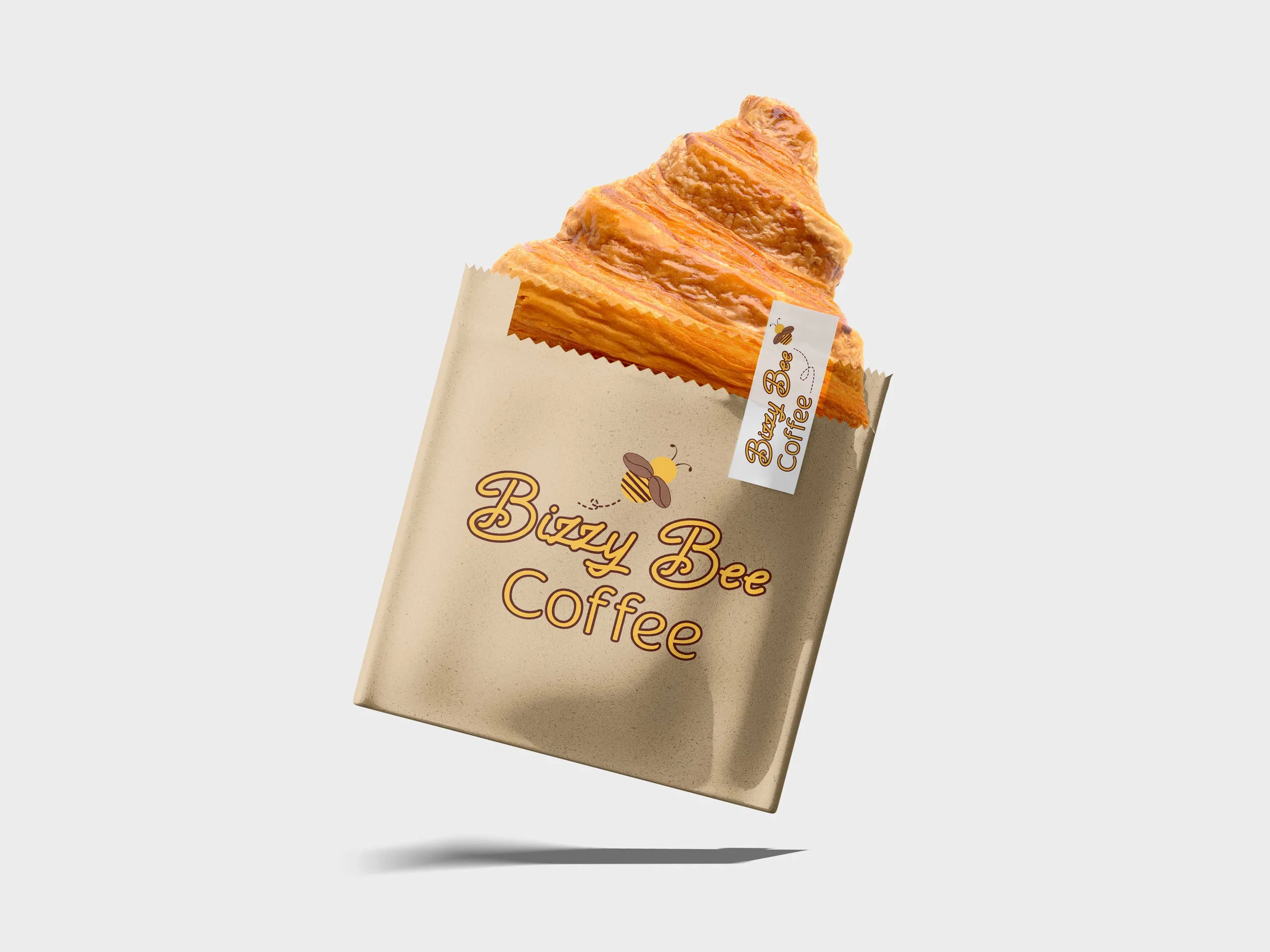 A coffee-flavored pastry in a beige wrapper labeled "Bizzy Bee Coffee" with a bee illustration and a tag reading "Bizzy Bee Coffee."