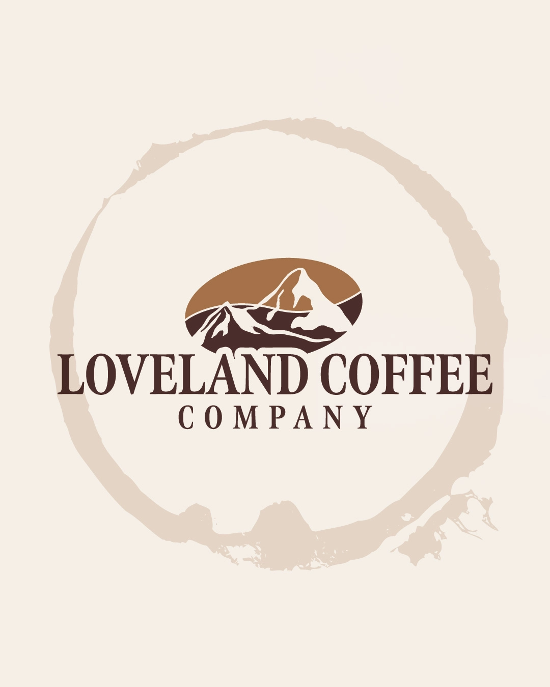 Logo for Loveland Coffee Company featuring a mountain range inside a circular emblem and the company name in brown text.