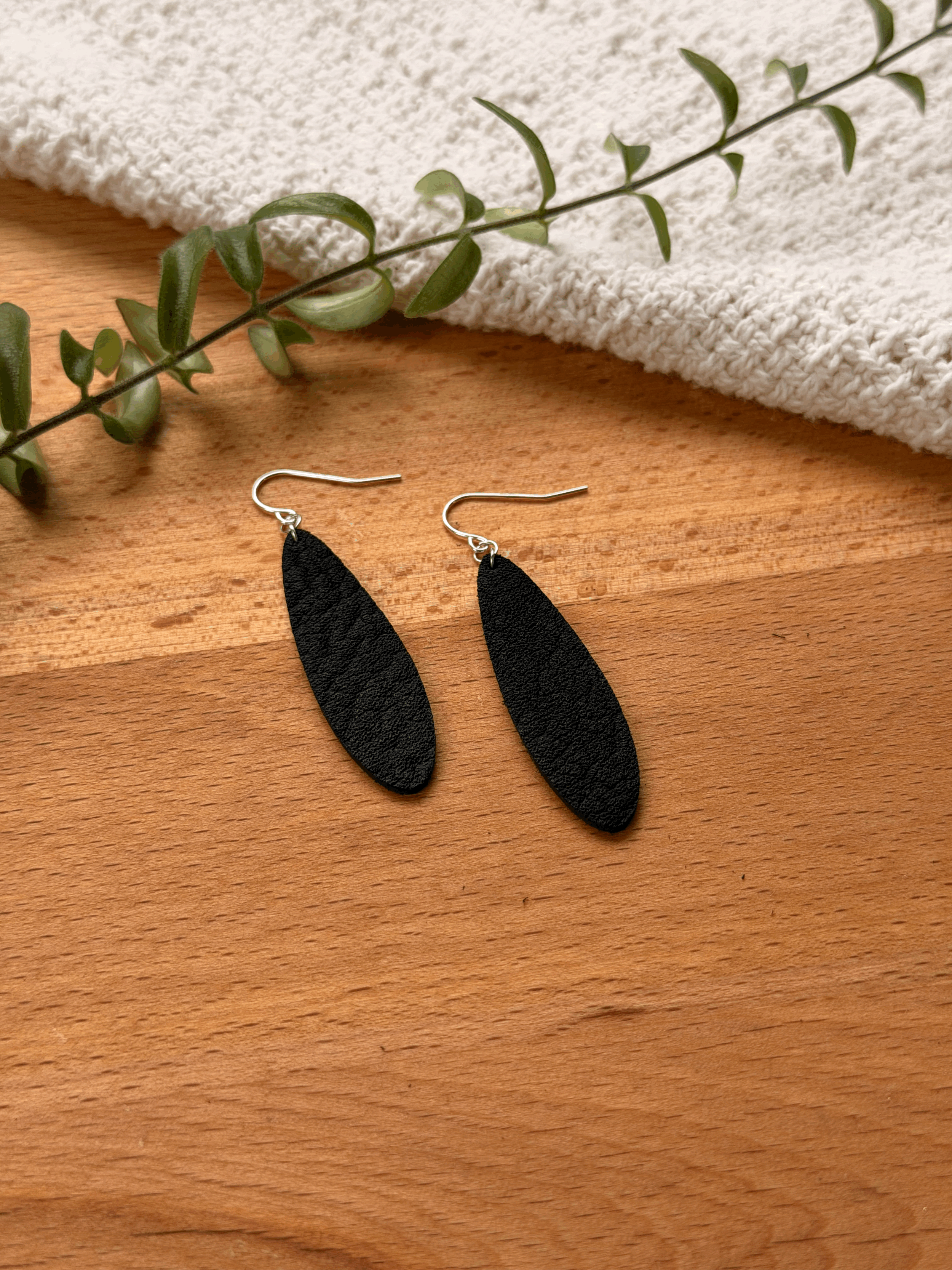 Teardrop earrings shown in Iron finish