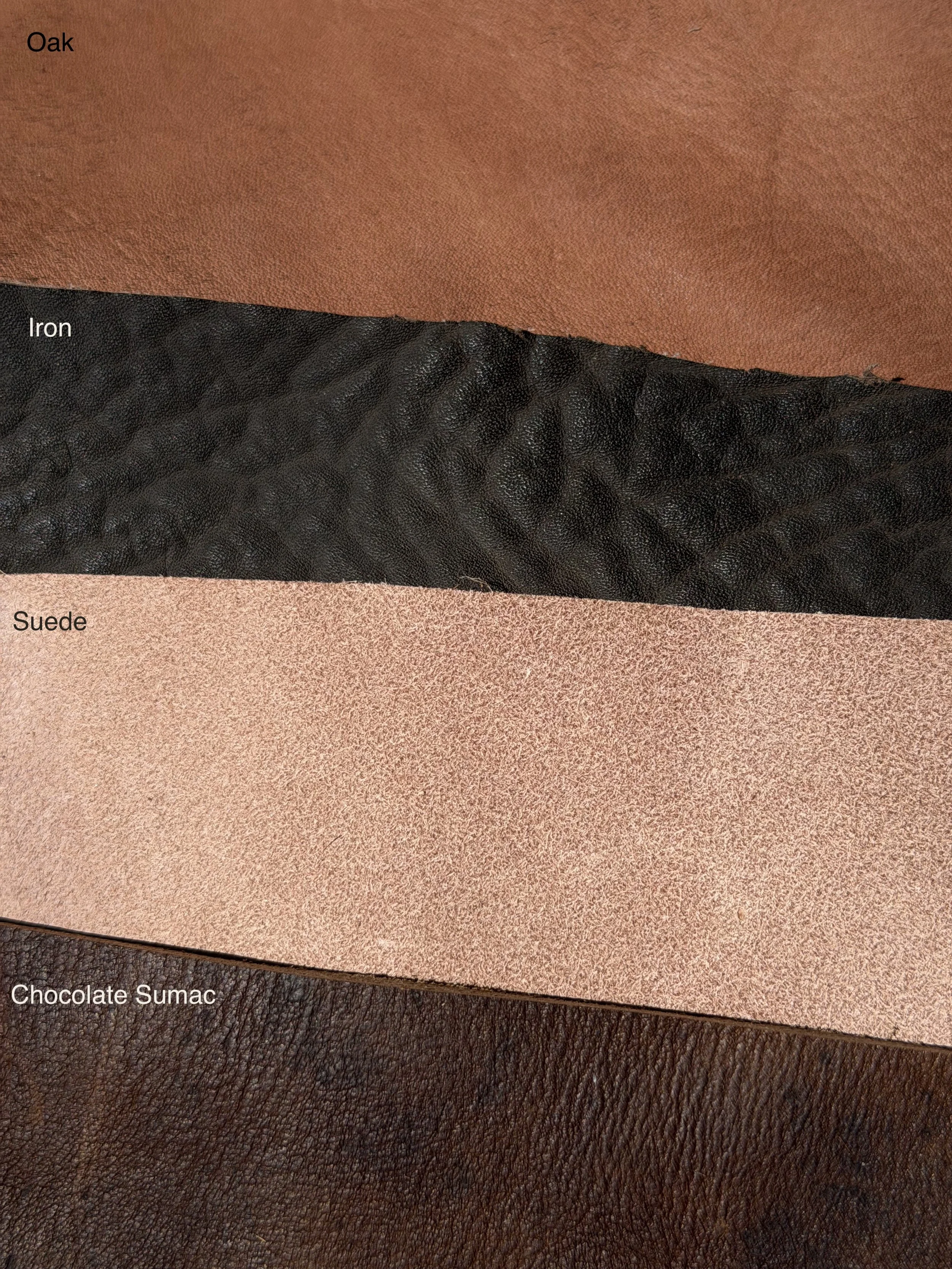 Oak, Iron, Suede, and Chocolate Sumac leather finish options