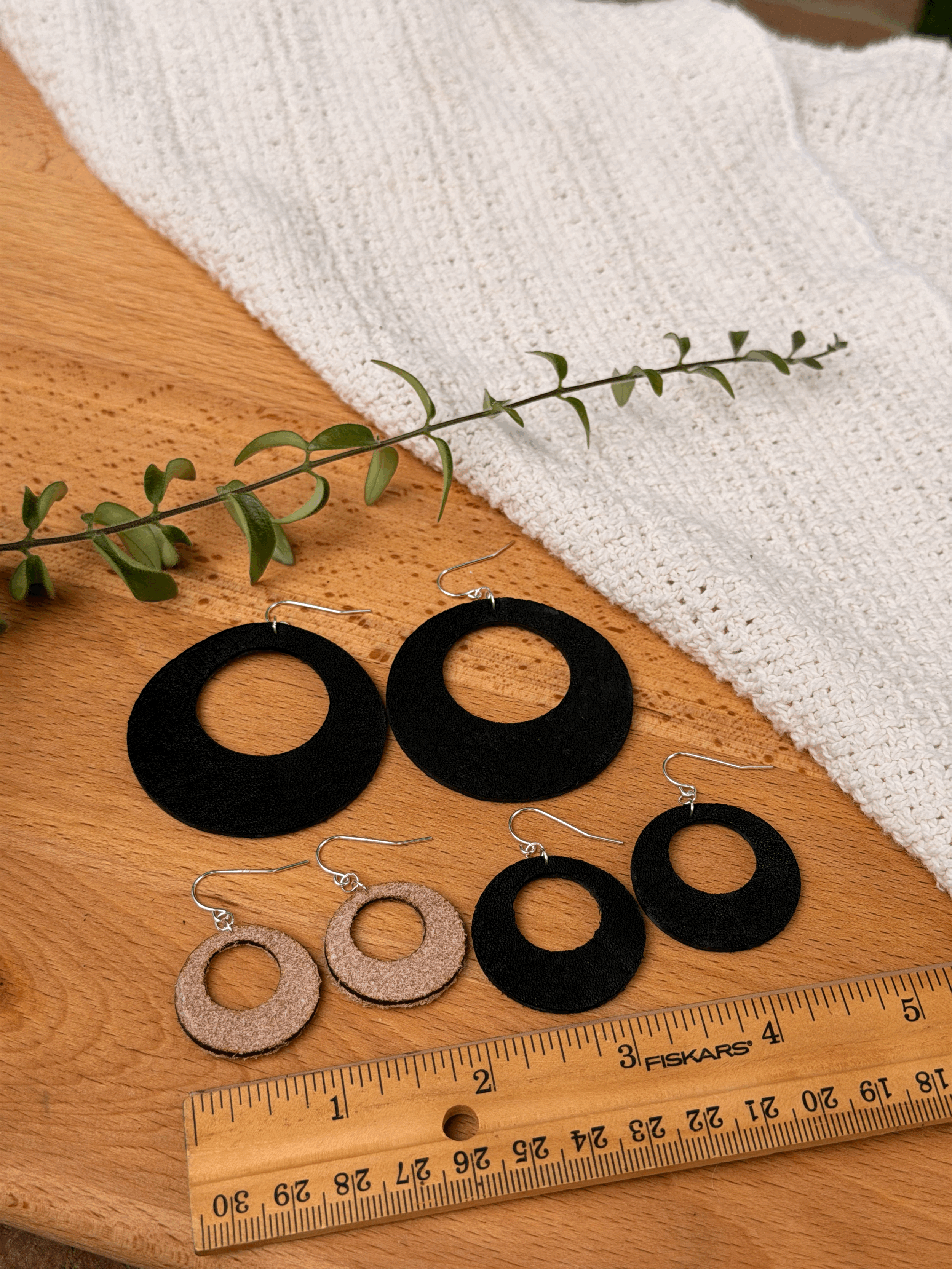 Open Circle Earrings shown in assorted sizes and finishes