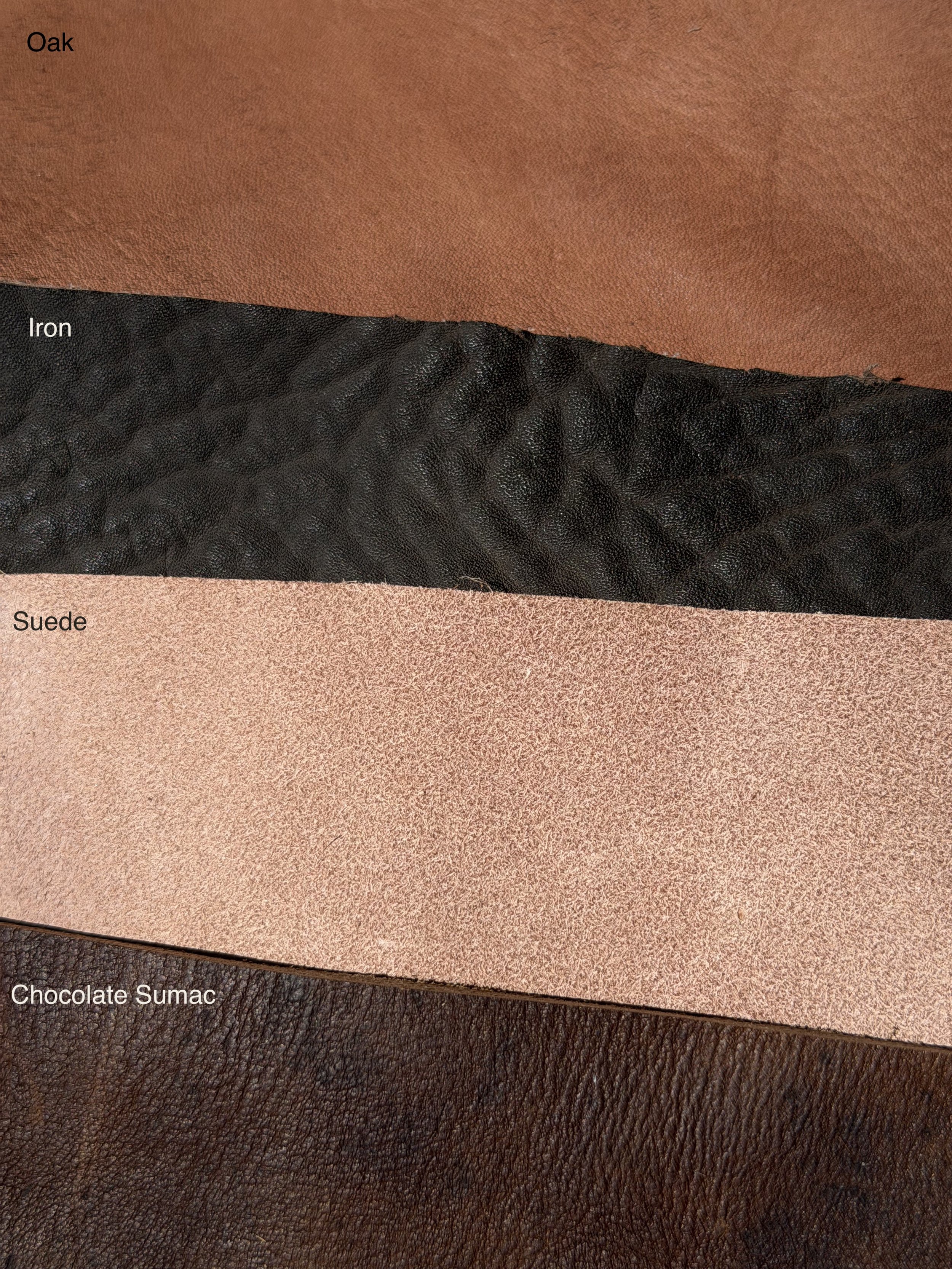 Oak, Iron, Suede, and Chocolate Sumac leather finish options