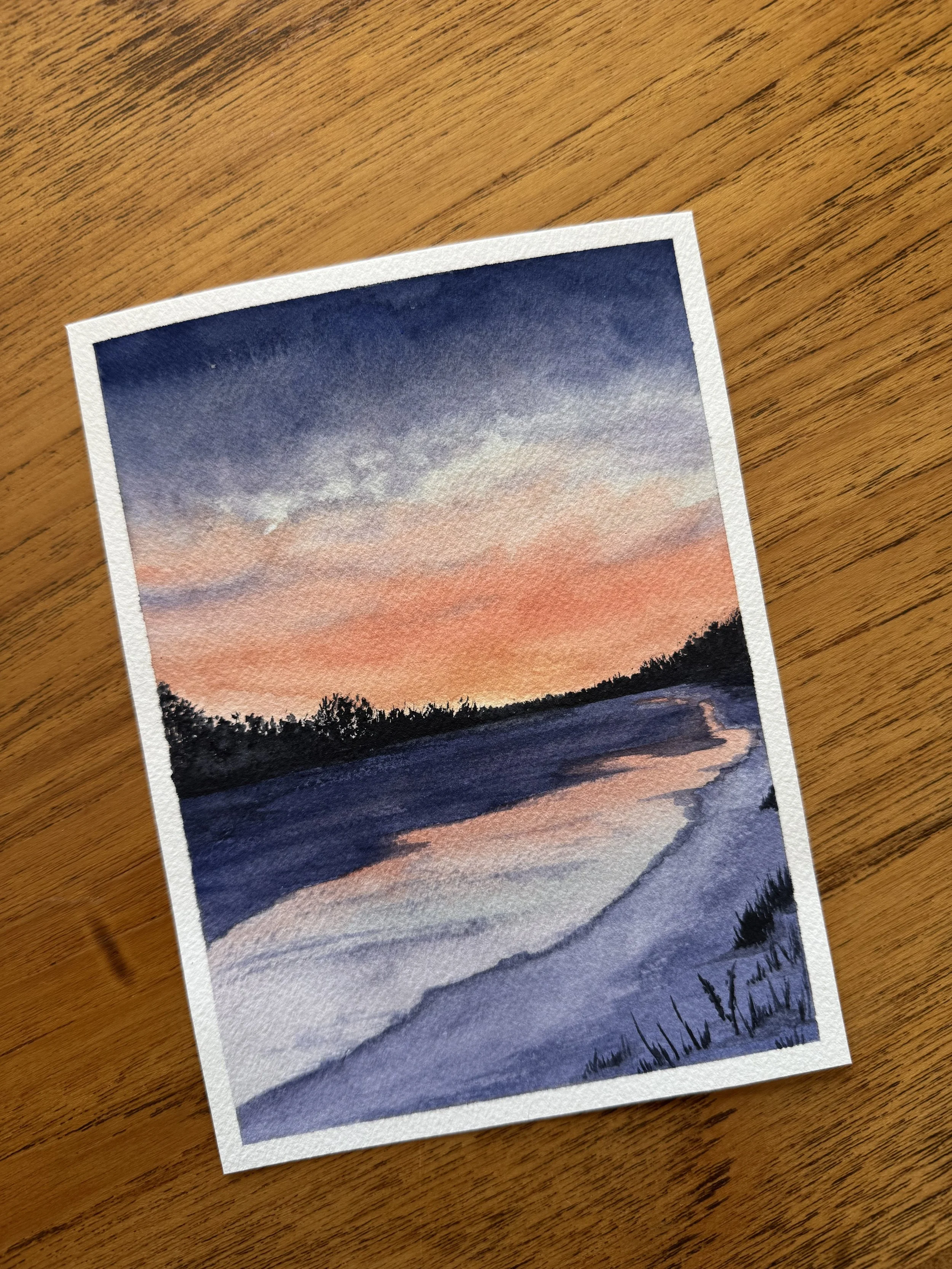 Original watercolour landscape painting of  a purple and orange sunrise on the bow river in Calgary