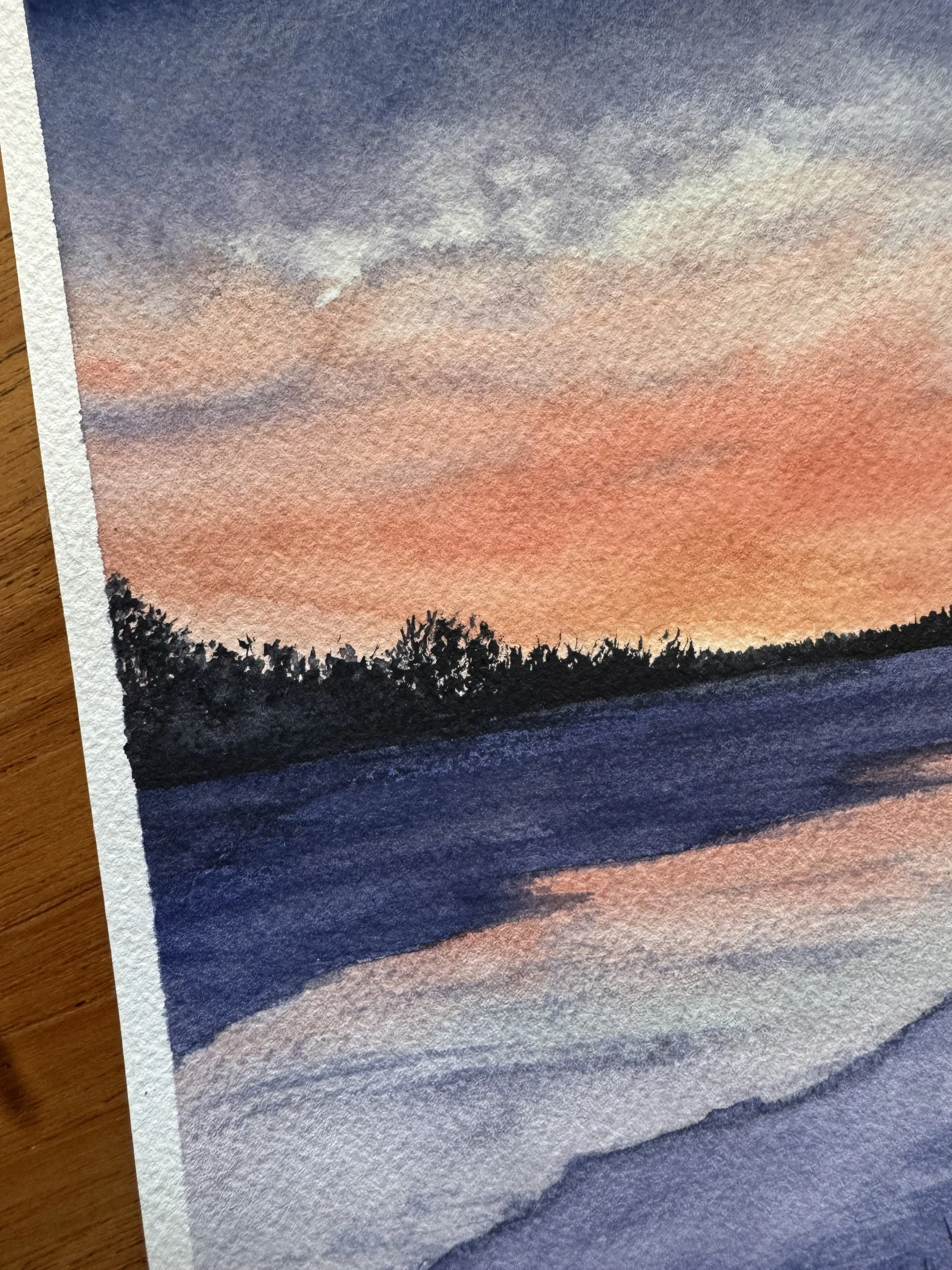 Original watercolour landscape painting of  a purple and orange sunrise on the bow river in Calgary