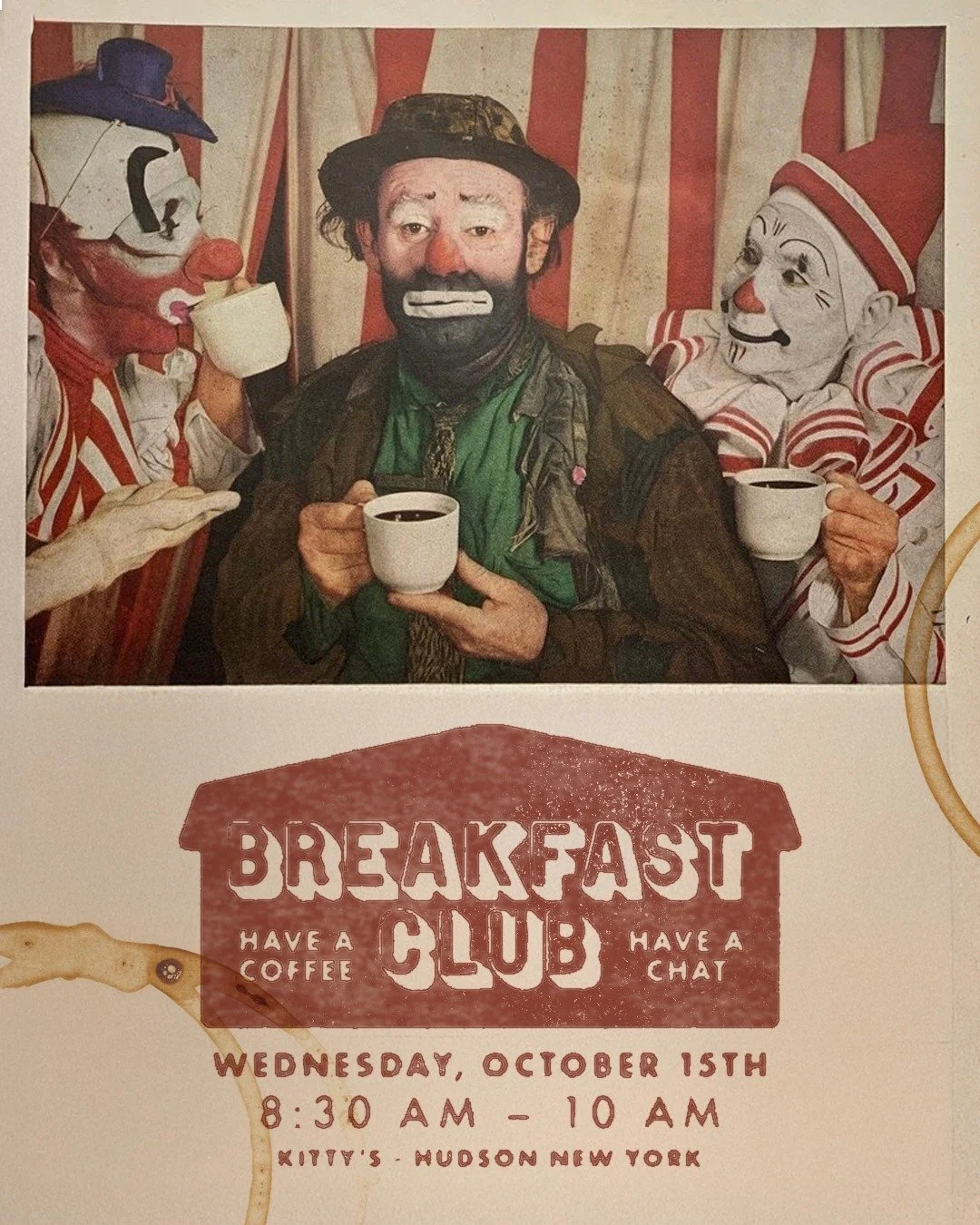 Photo of a man with clown and mime characters, all holding coffee cups, in front of a sign for a breakfast club event in New York.