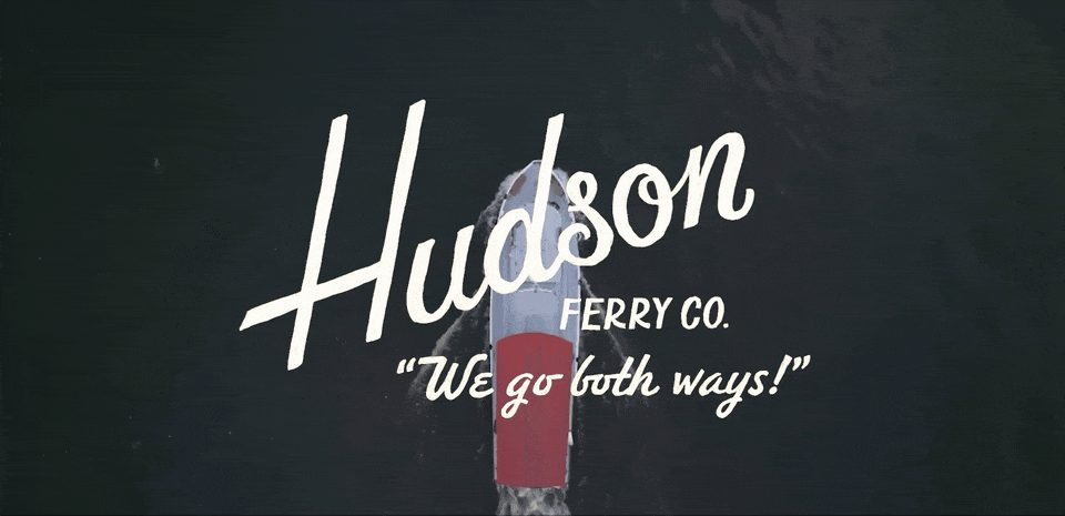 A boat in water with a sign that reads 'Hudson Ferry Co.' and the slogan 'We go both ways!'