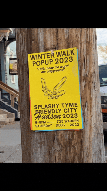 Yellow poster advertising Winter Walk Popup 2023 at Hudson in Warren, with slogan 'Let's make the world our playground,' featuring an illustration of a seesaw, scheduled for December 2, 2023, from 5 to 8 PM.