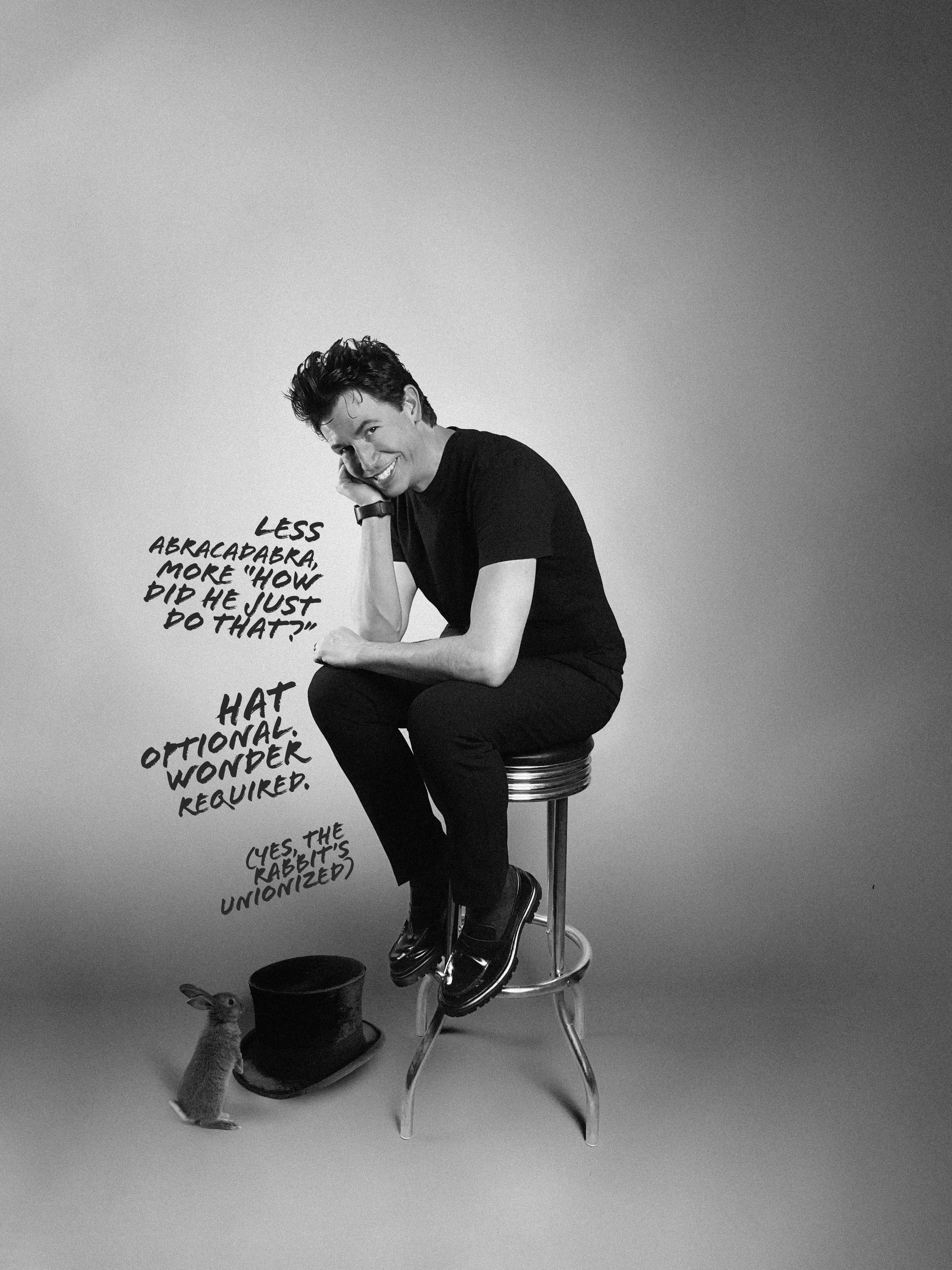 Joshua Erichsen - Magician on bar stool with rabbit and hat