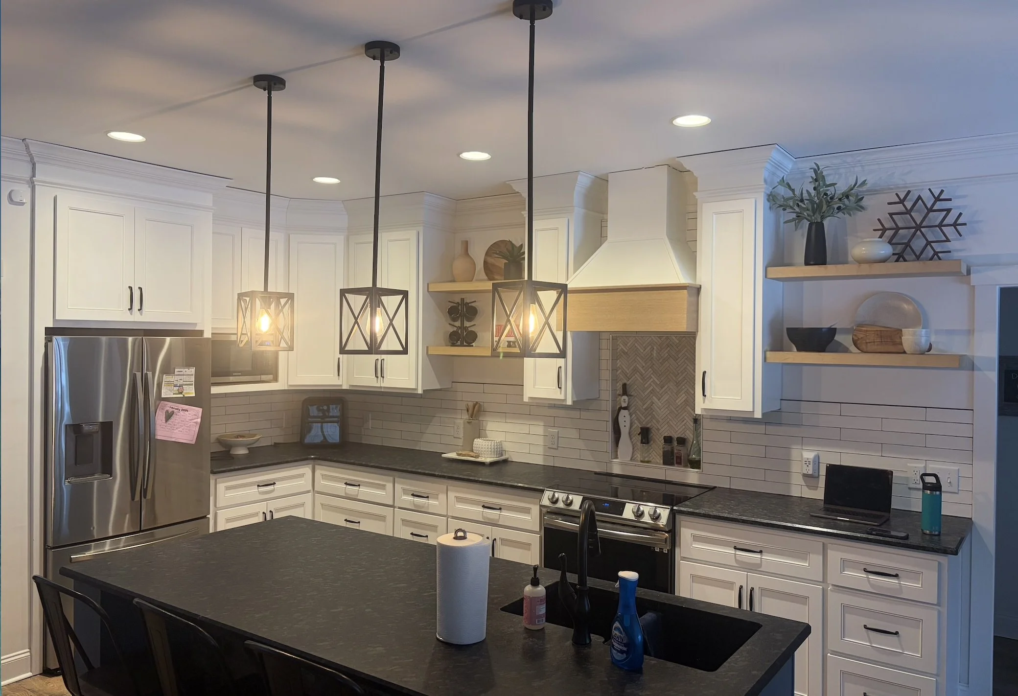 Custom cabinets built in Gibsonville North Carolina.  Floating shelves.  Custom range hood.  White oak