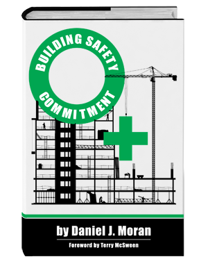 Book cover titled 'Building Safety Commitment' by Daniel J. Moran, with a construction site illustration, a crane, and a green medical cross symbol.