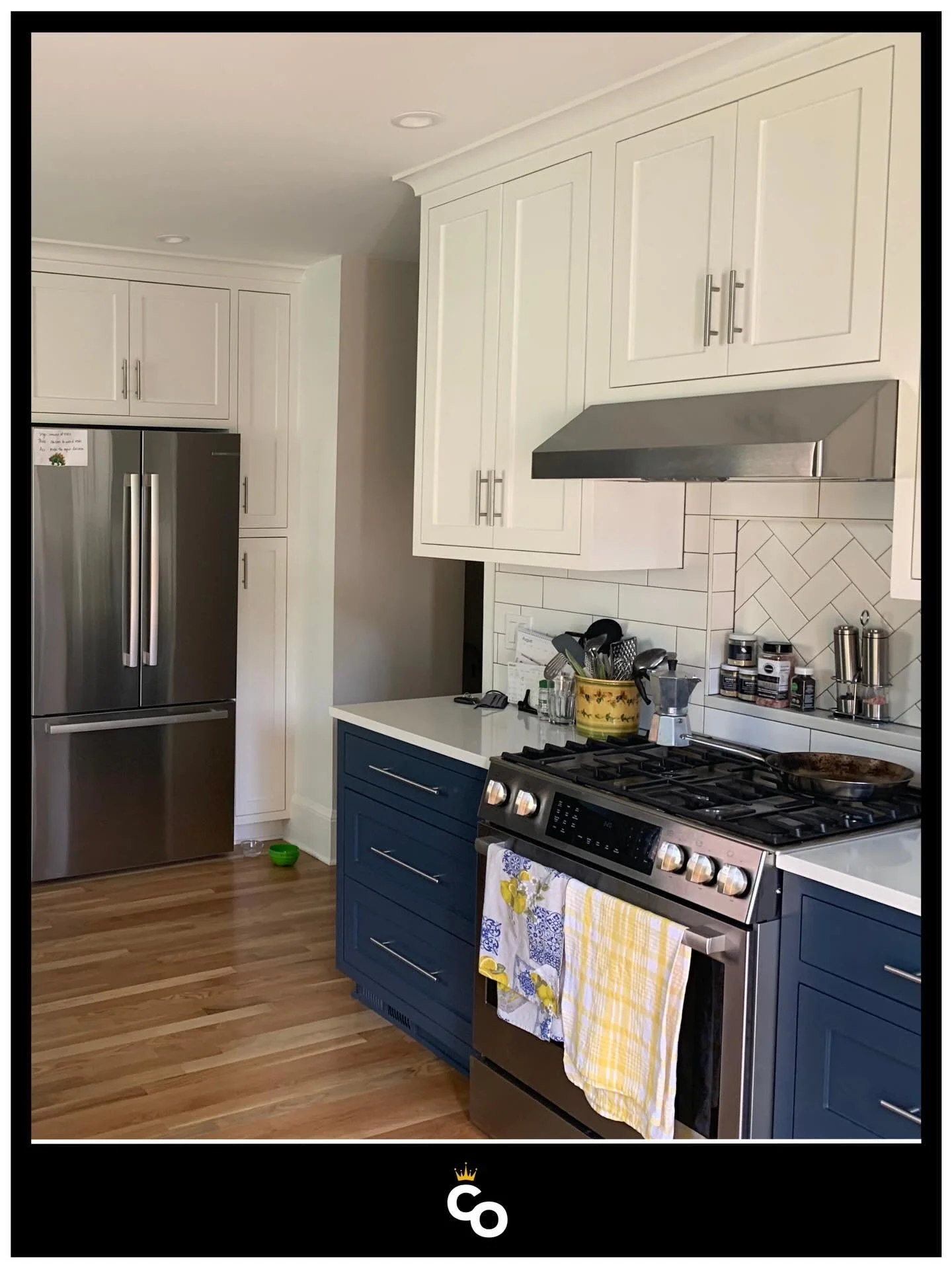 Two-tone done right. Refinished cabinets that add contrast without overcomplicating the space.