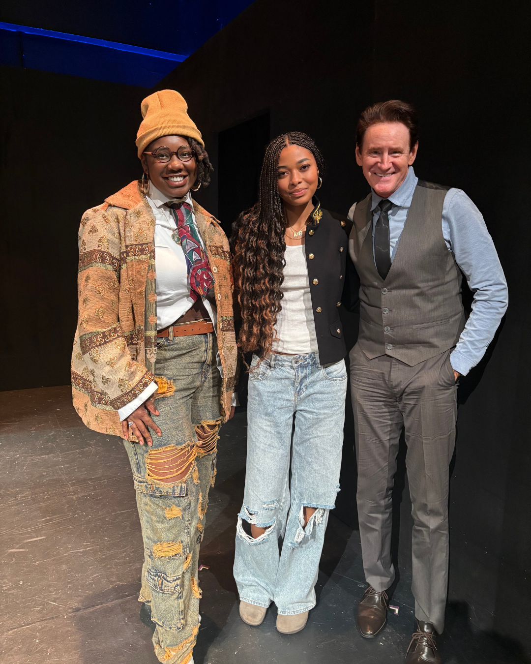 Mychal bella bowman standing together with cracked open the play cast, smiling at the camera