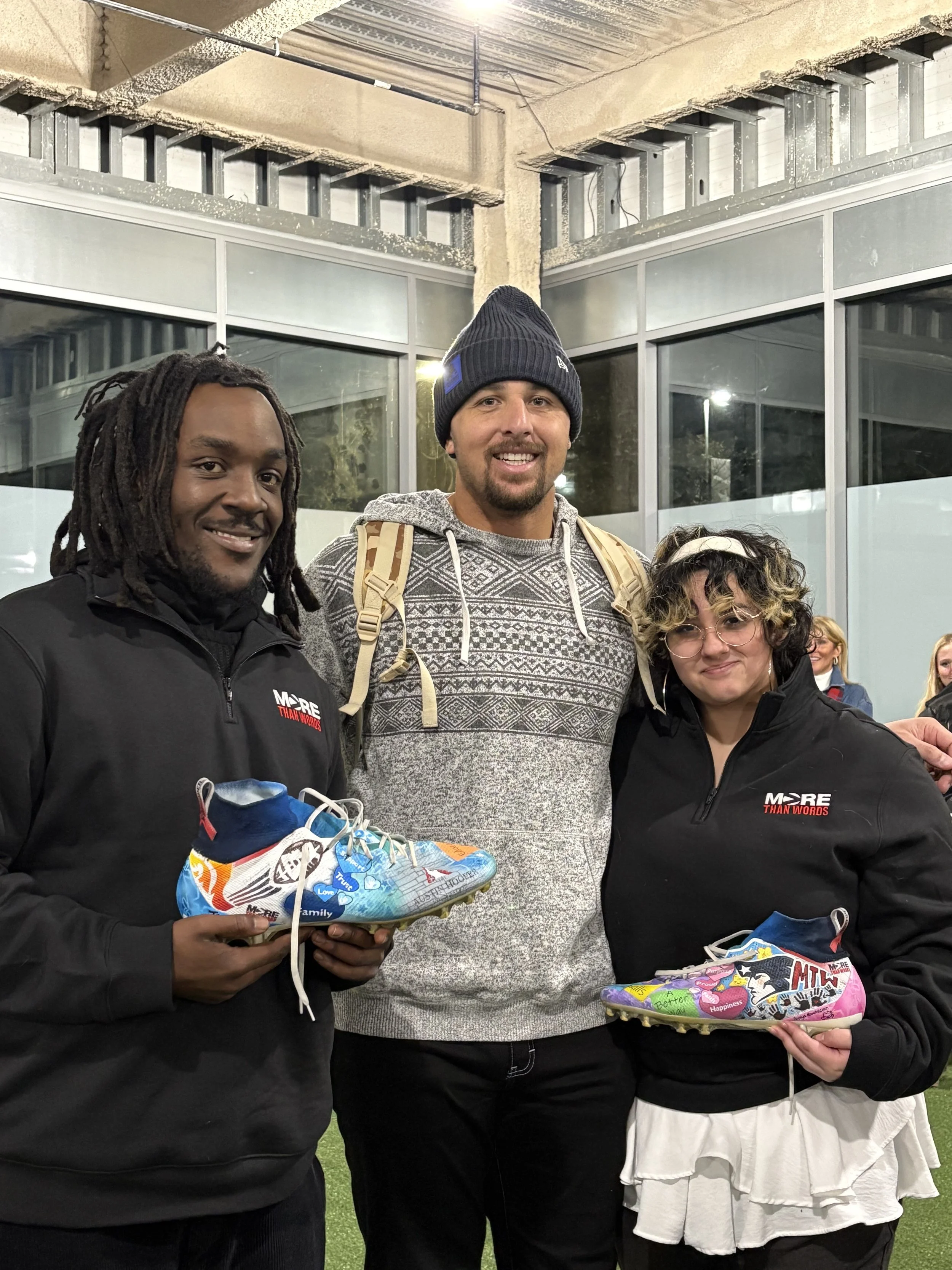 NFL football player Austi Hooper with Artem Vale Foundation showing my cause my cleats for mental health
