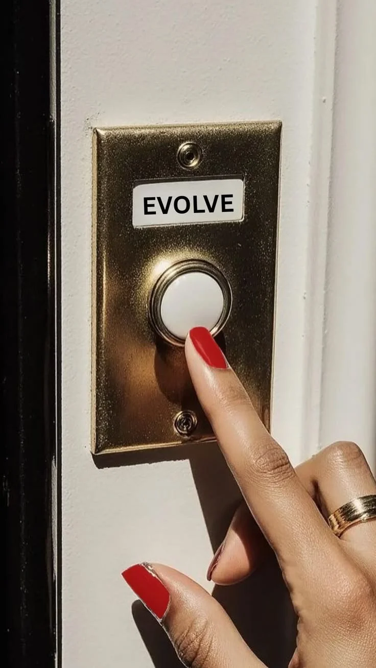 A person with red nail polish pressing a doorbell button, which has a label that says 'EVOLVE'.