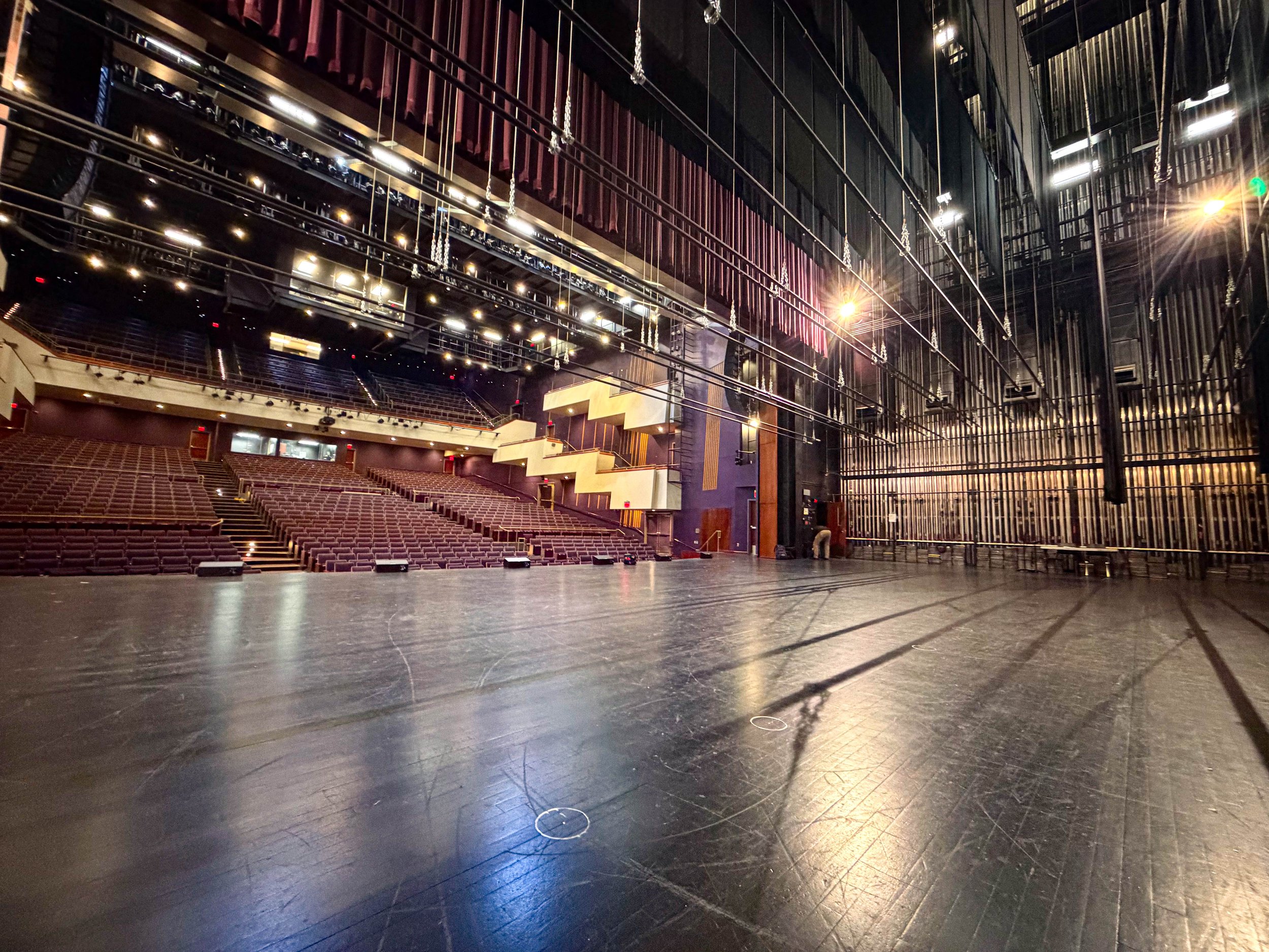 An image of a theatre stage and seating