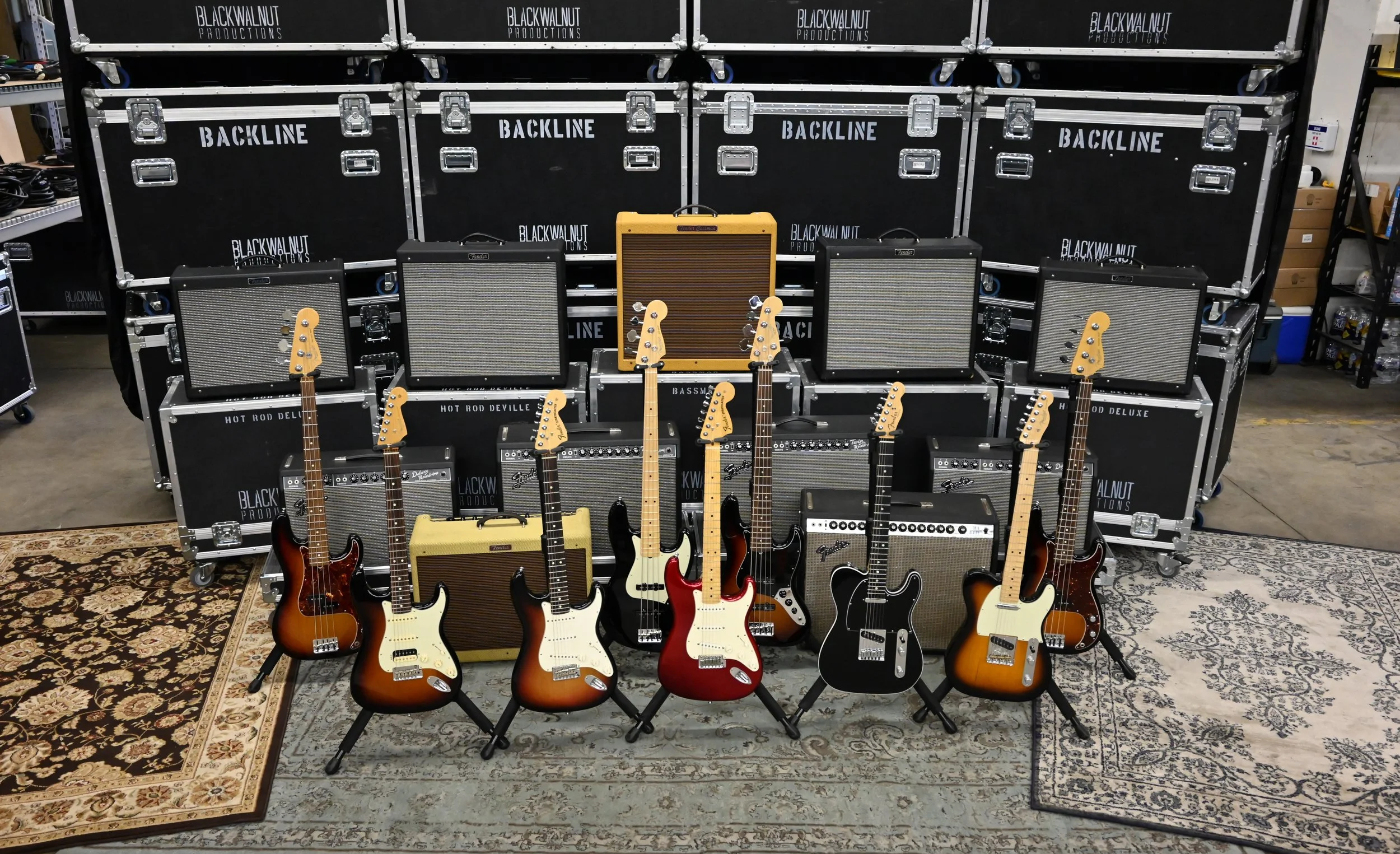 multiple electric guitars and amps for backline use