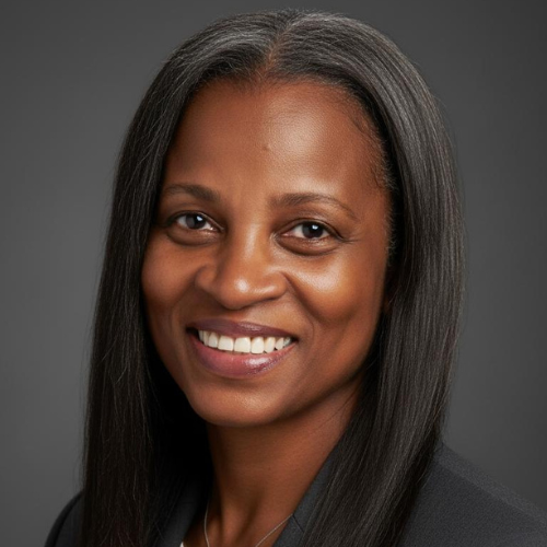 Headshot of a smiling African American woman with long, straight black hair against a gray background.