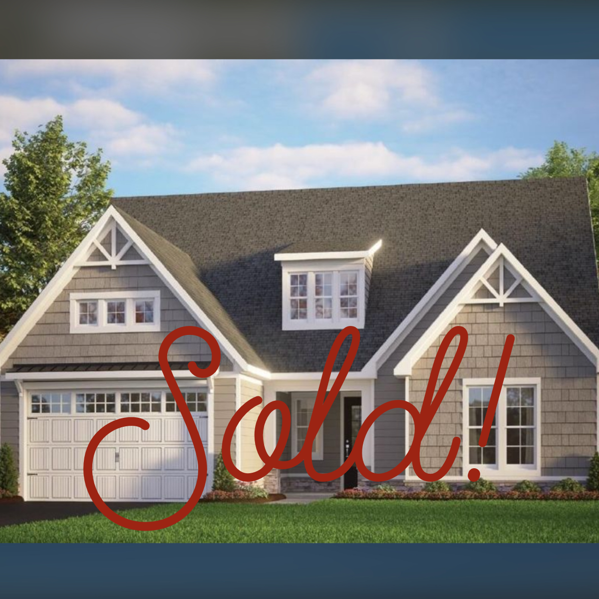 A two-story house with gray siding, white trim, a dark gray roof, and a two-car garage has large red text overlay that says "Sold!" in front of the house.