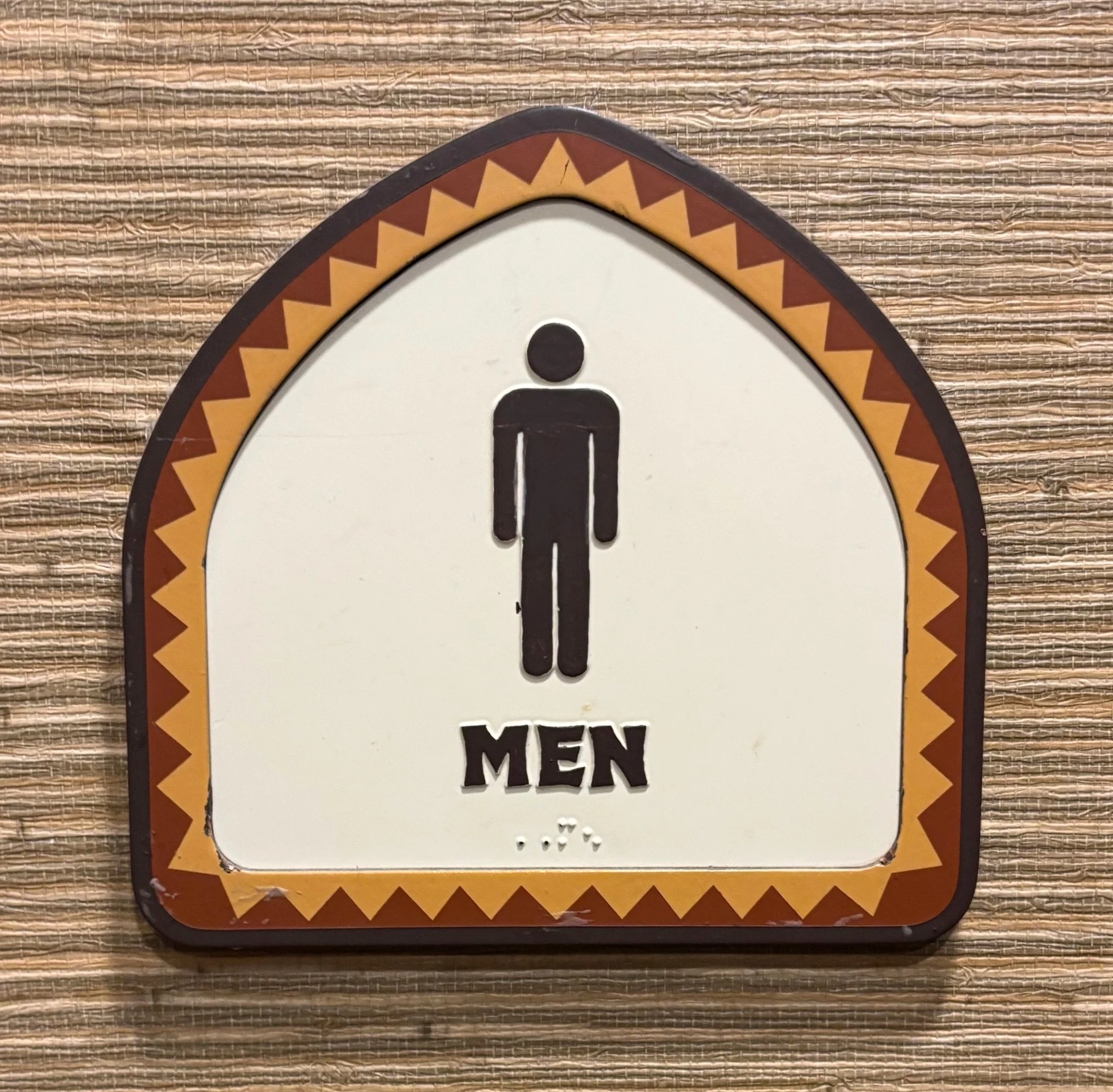 poly downstairs men sign.jpg
