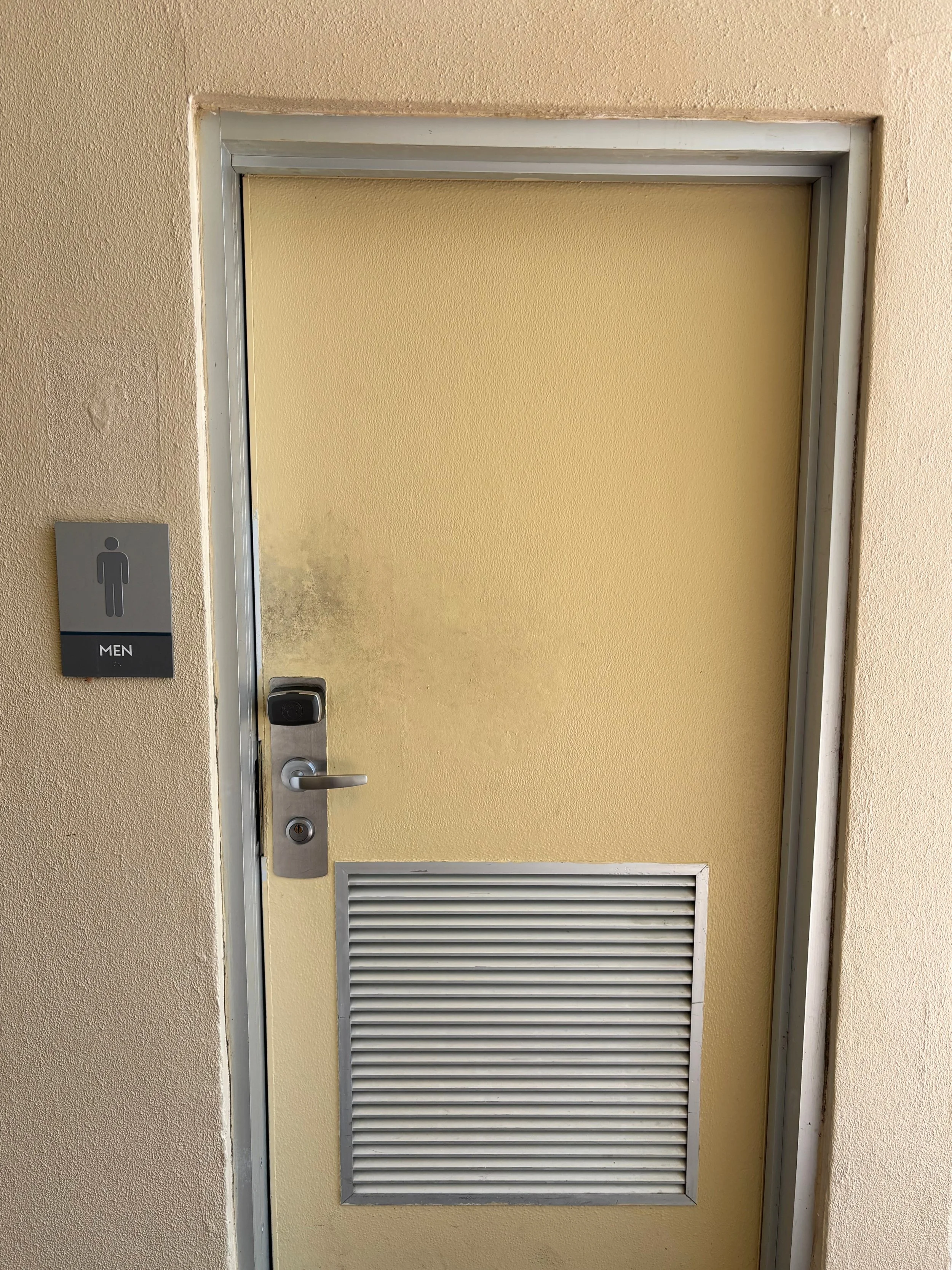 cont outside men door and sign.jpg
