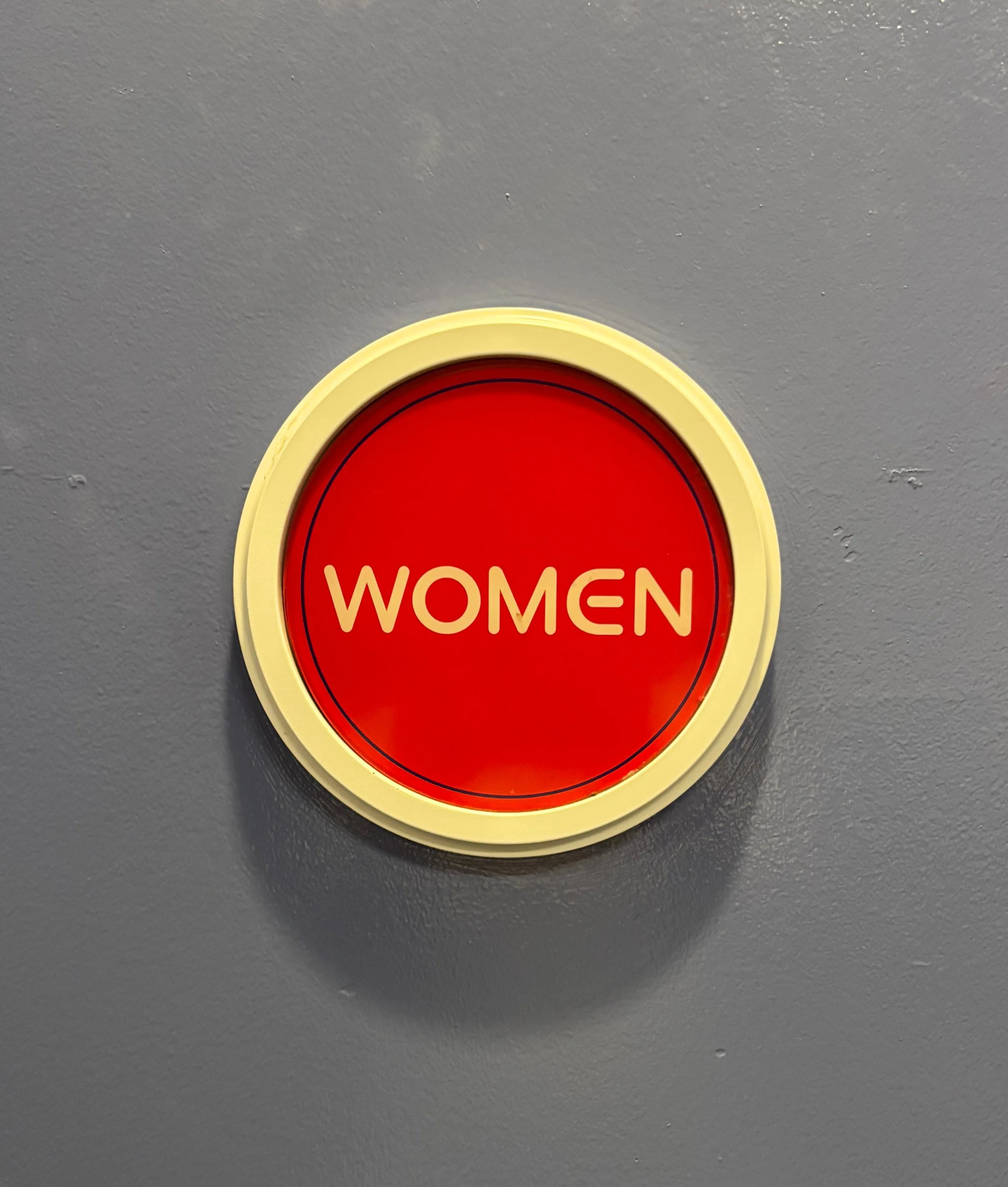 cosmic red women sign.jpg
