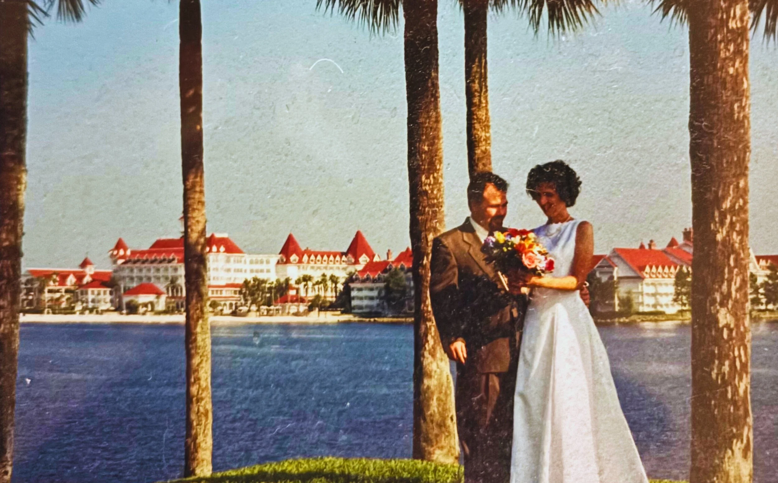 On the hill at the Polynesian Resort, Maggie and Dave got married. We are looking at my bridal bouquet and The Grand Floridian is in the background.