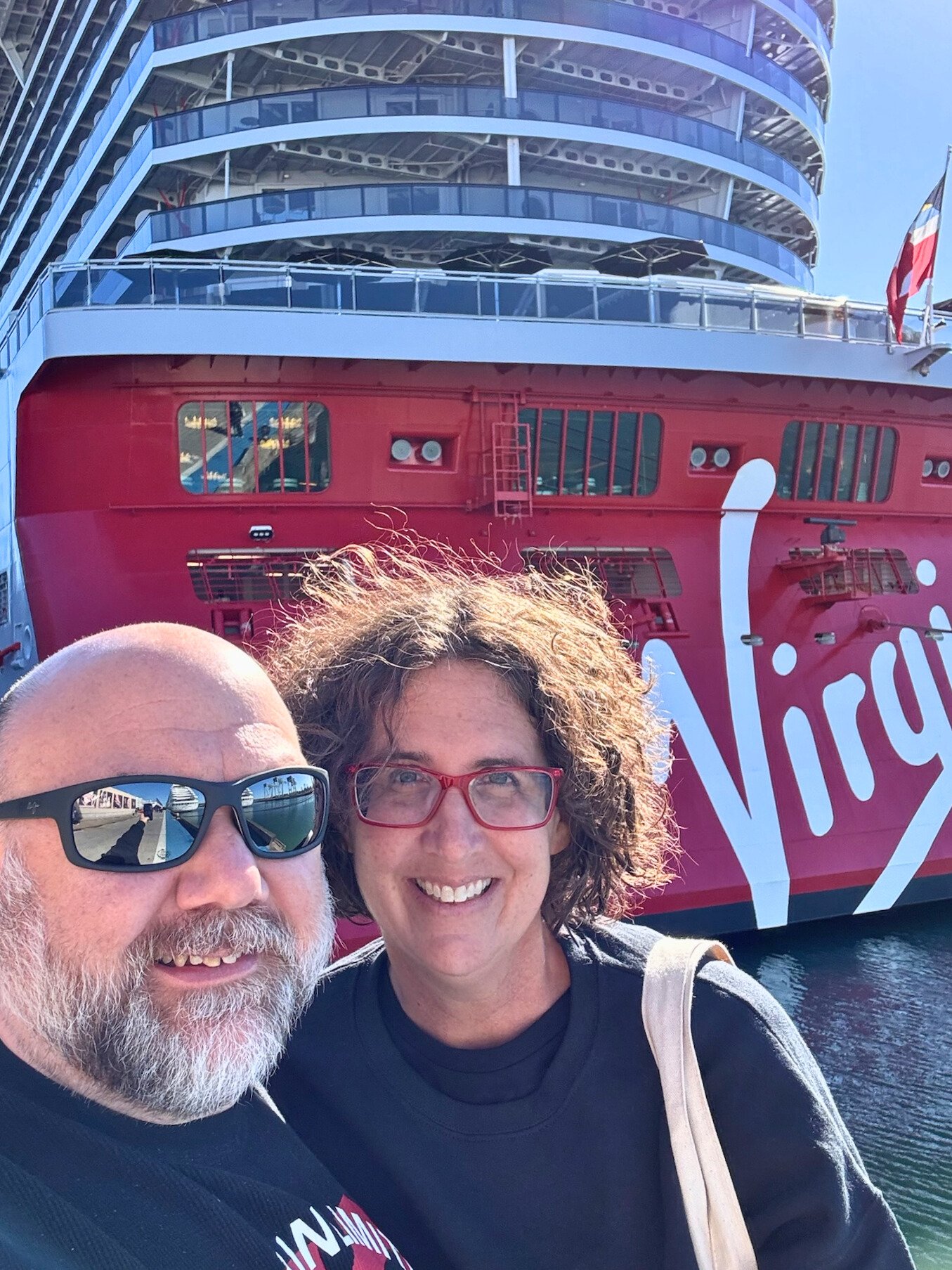 Dave and Maggie proudly stand in front of The Brilliant Lady, Virgins Voyages newest ship. We were on a 13 night Fall voyage starting from Quebec City.