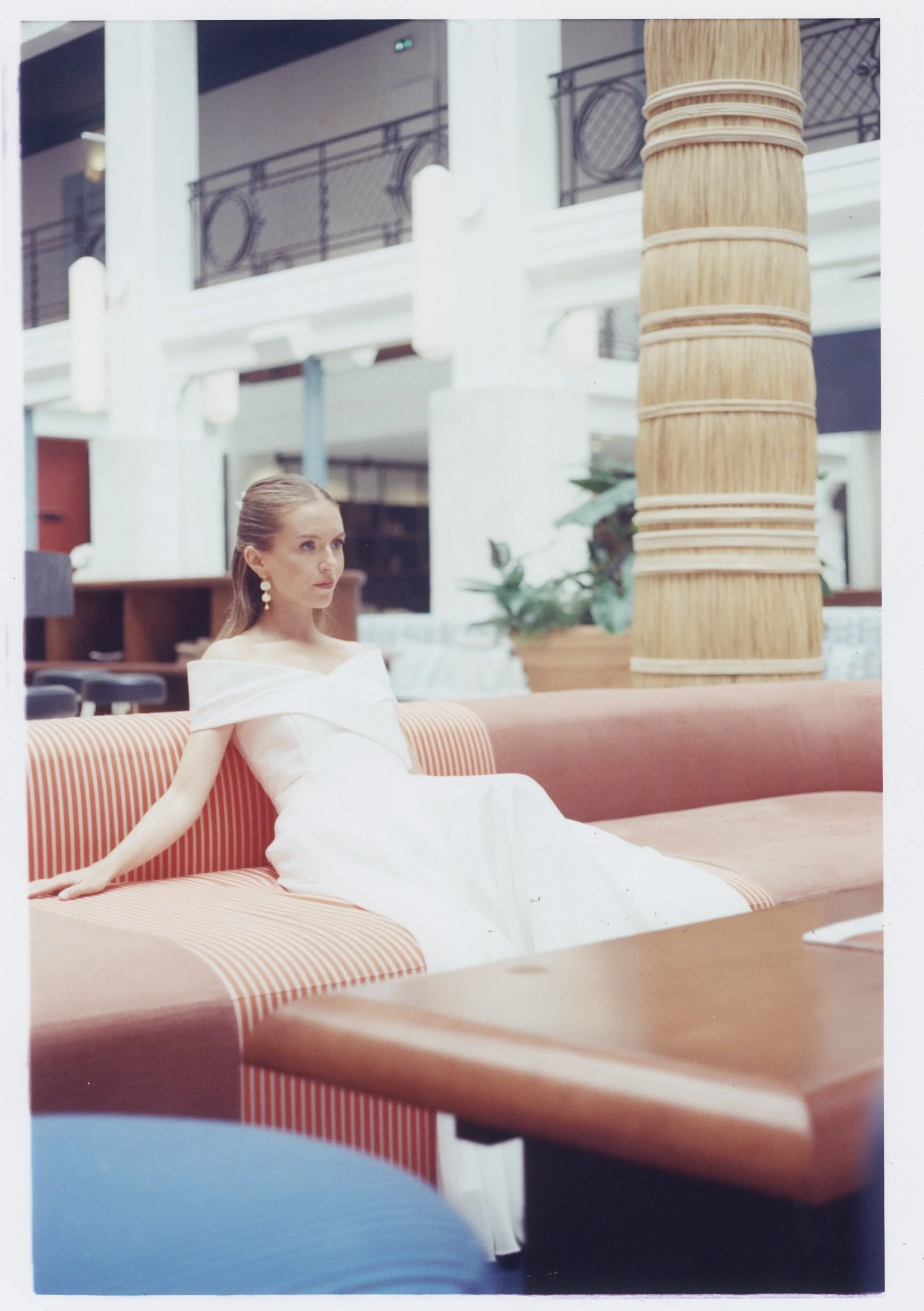 Photo of a bride on her wedding day. The chosen film increases that blue ambiance and softens the colors, as it's a film that's used for cinema. 
Photo taken in a luxurious hotel in Biarritz (South of France). 
Film photo, 35mm Sunbath 500T, Canon A1