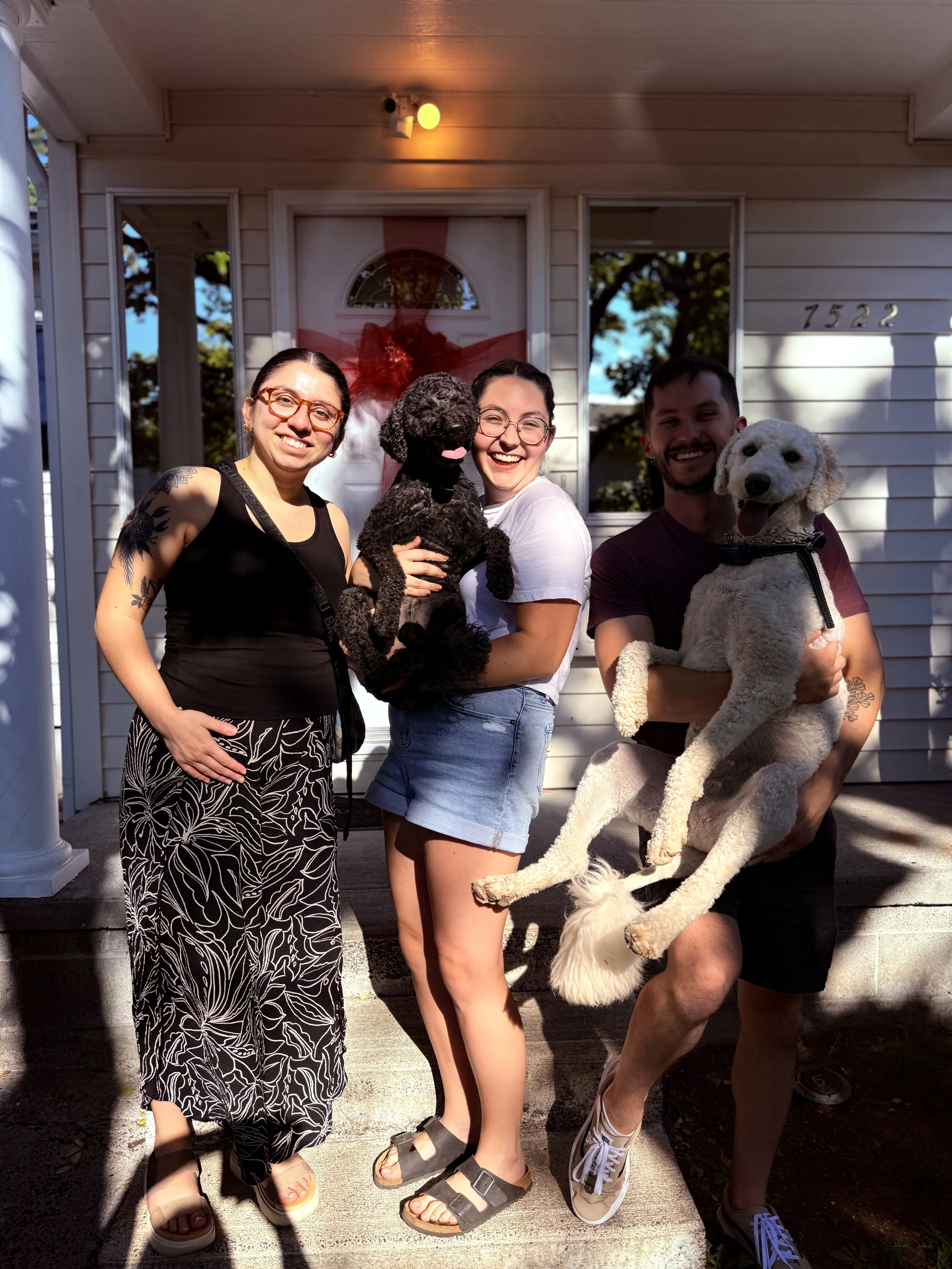 Brooke celebrating Key Day on the front porch of her North Portland home with her brother, sister-in-law, and their two dogs