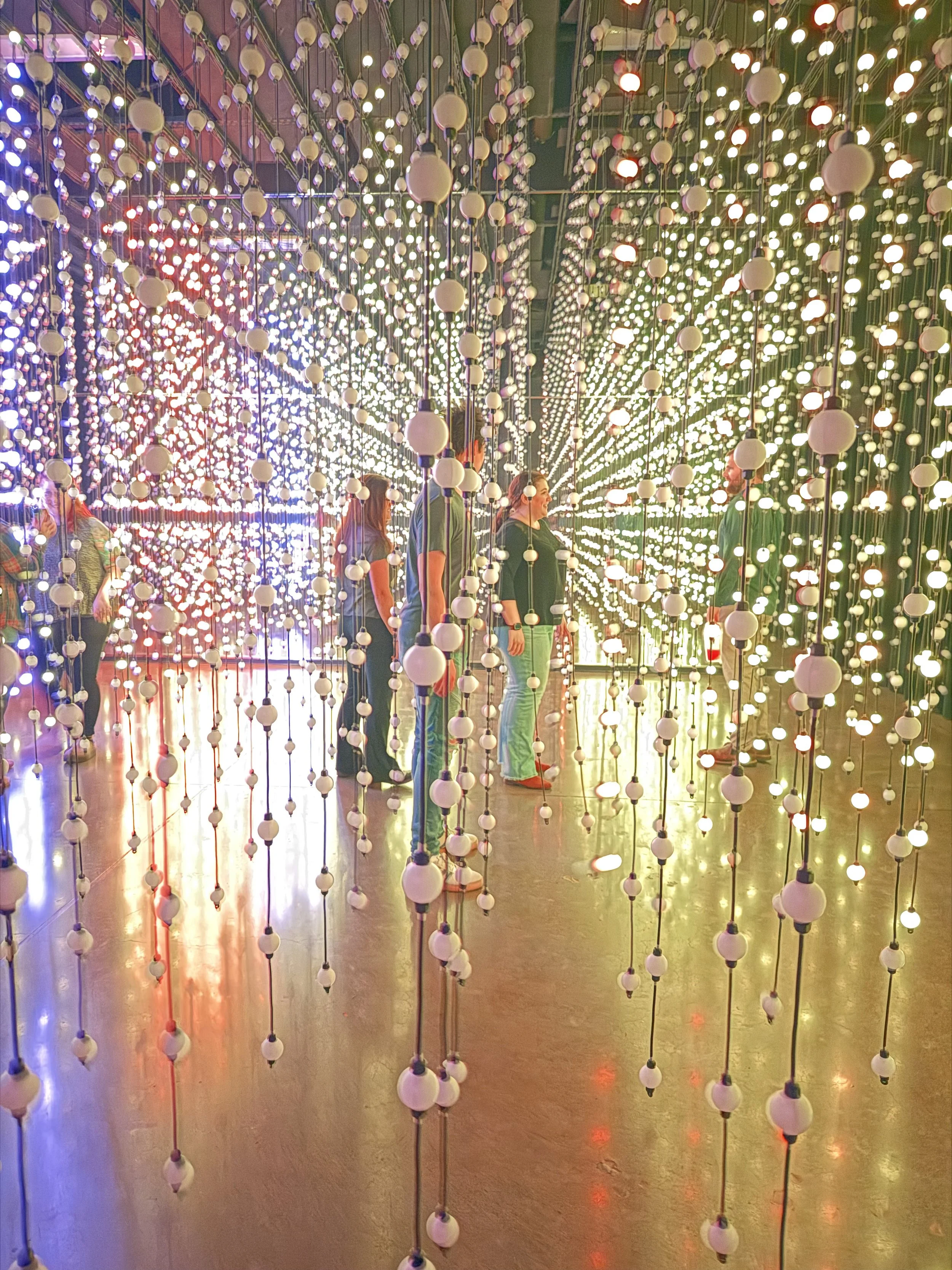 Guests exploring illuminated displays during Hopscotch VIP client evening in Portland, OR