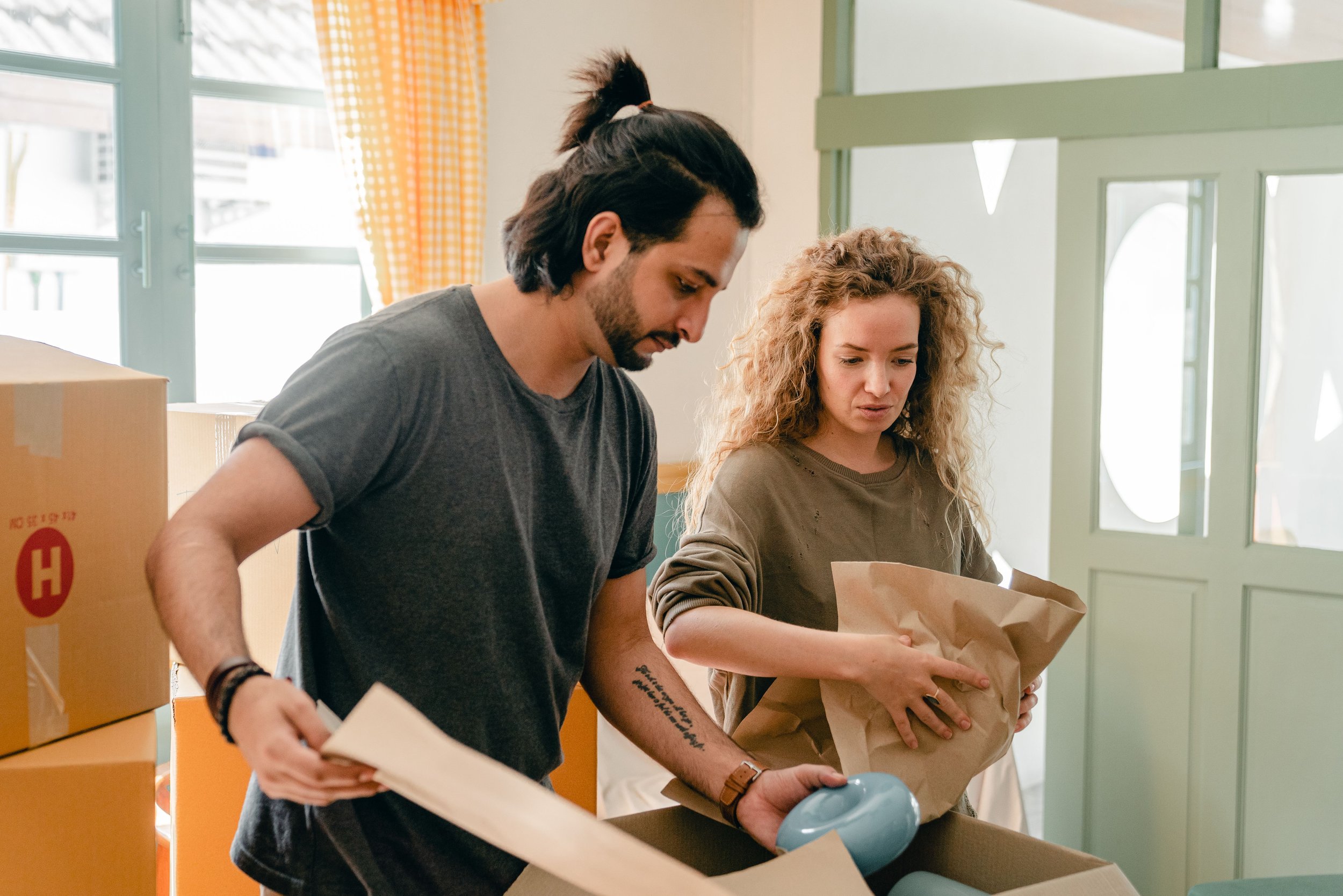 Homeowners planning their next move while packing at home