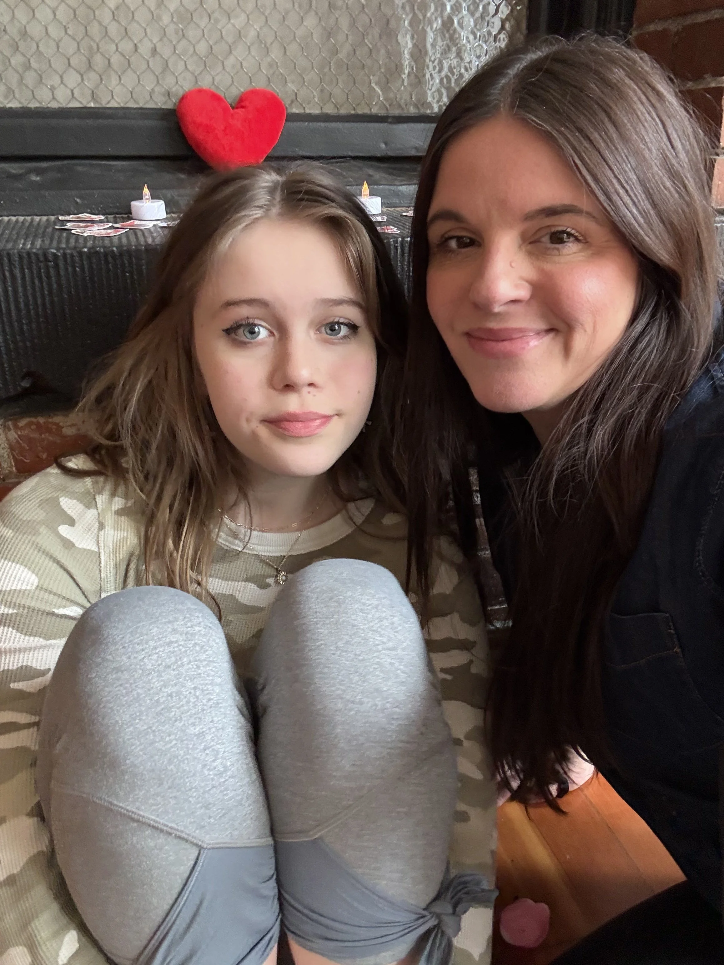 Group of VIP clients stretching and laughing with puppies during Puppy Yoga 2026 with real estate agent Rhonda Riley in Portland, OR