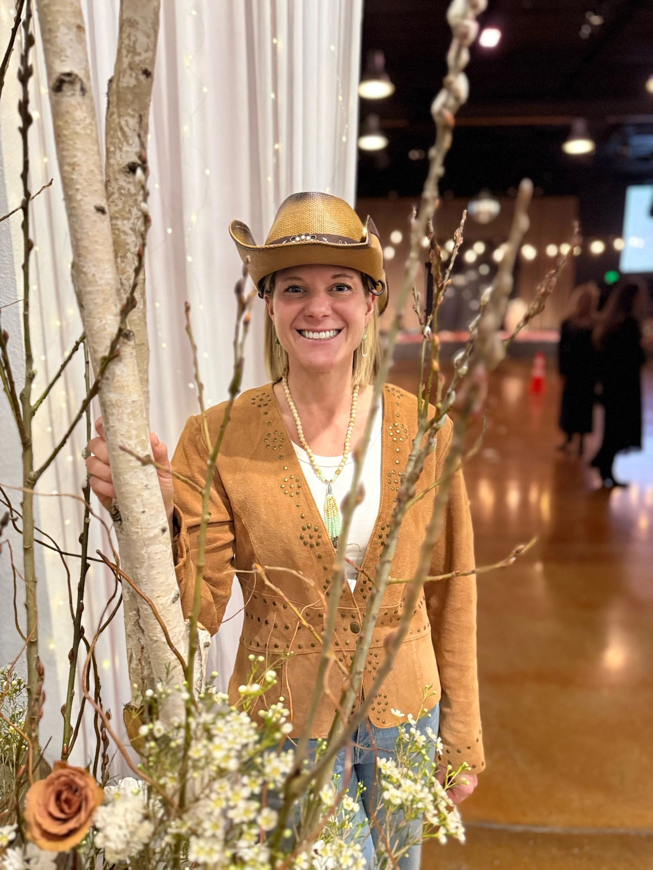 Rhonda Riley smiling in a cowboy hat at the Young Life Father Daughter Dance photo in Portland, OR