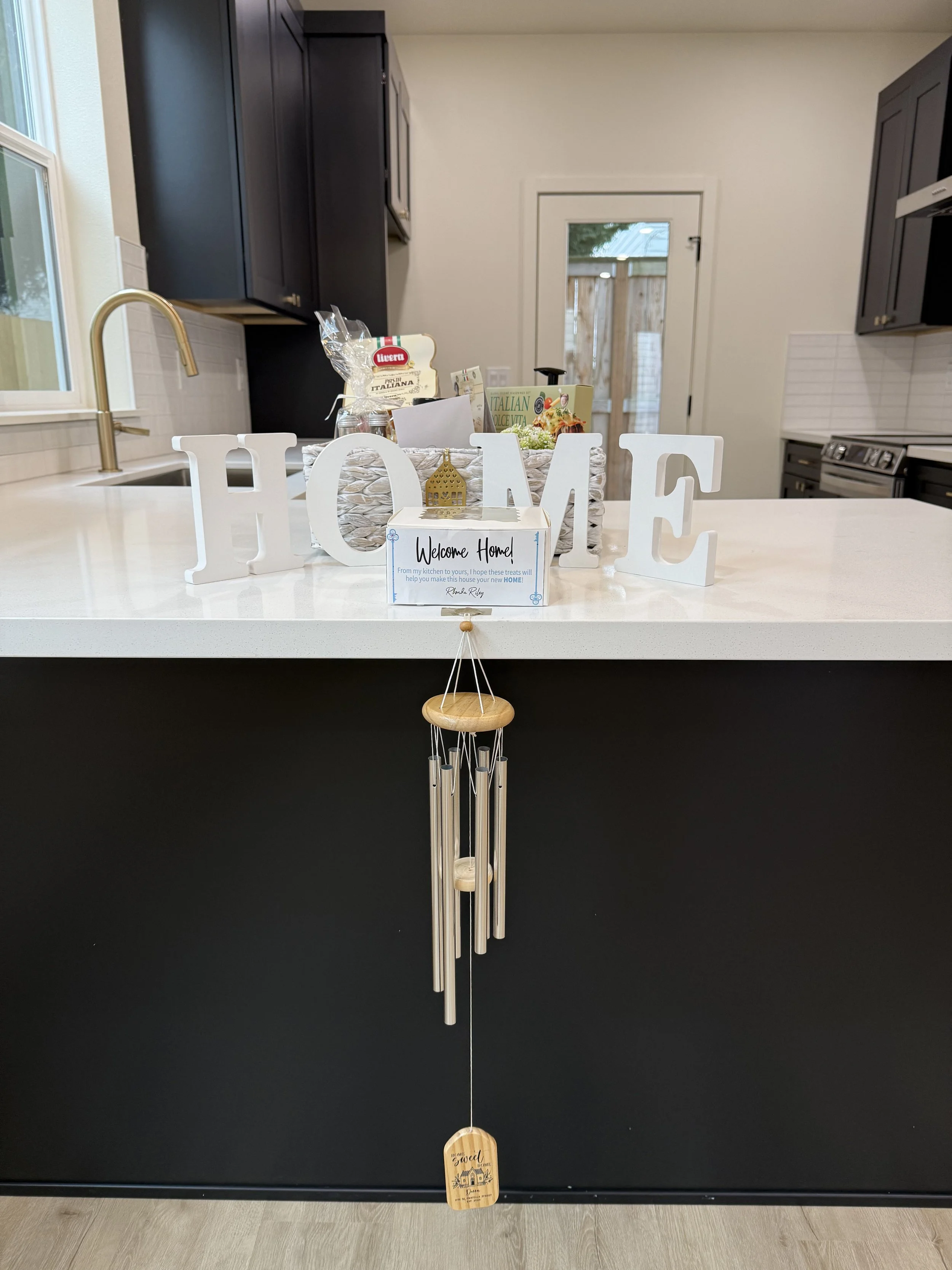 Client closing gifts from real estate agent Rhonda Riley including homemade cookies and welcome package for Donna in Sellwood Portland OR