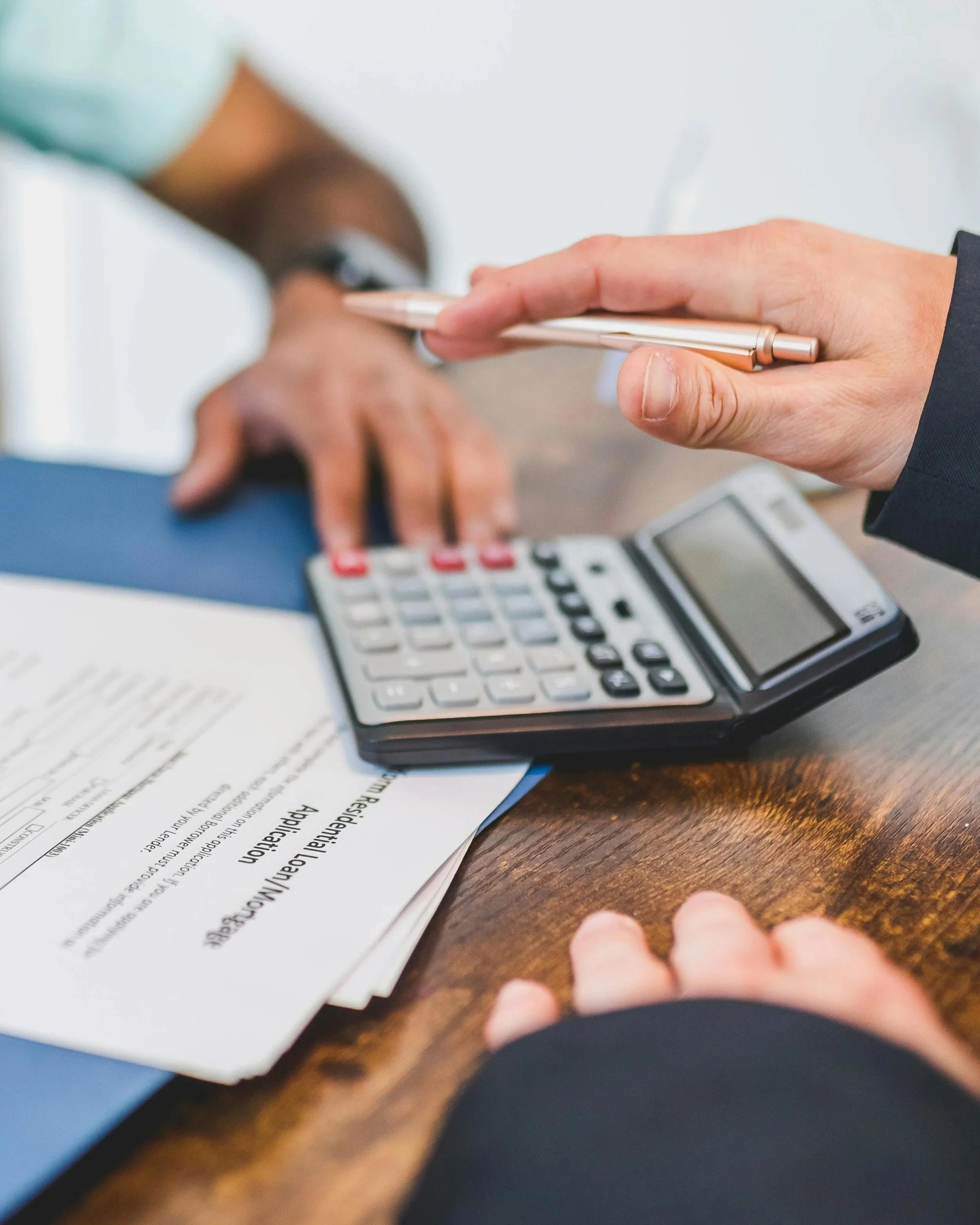 Reviewing a residential loan application and monthly payments to establish a clear budget for a 2026 real estate transition.