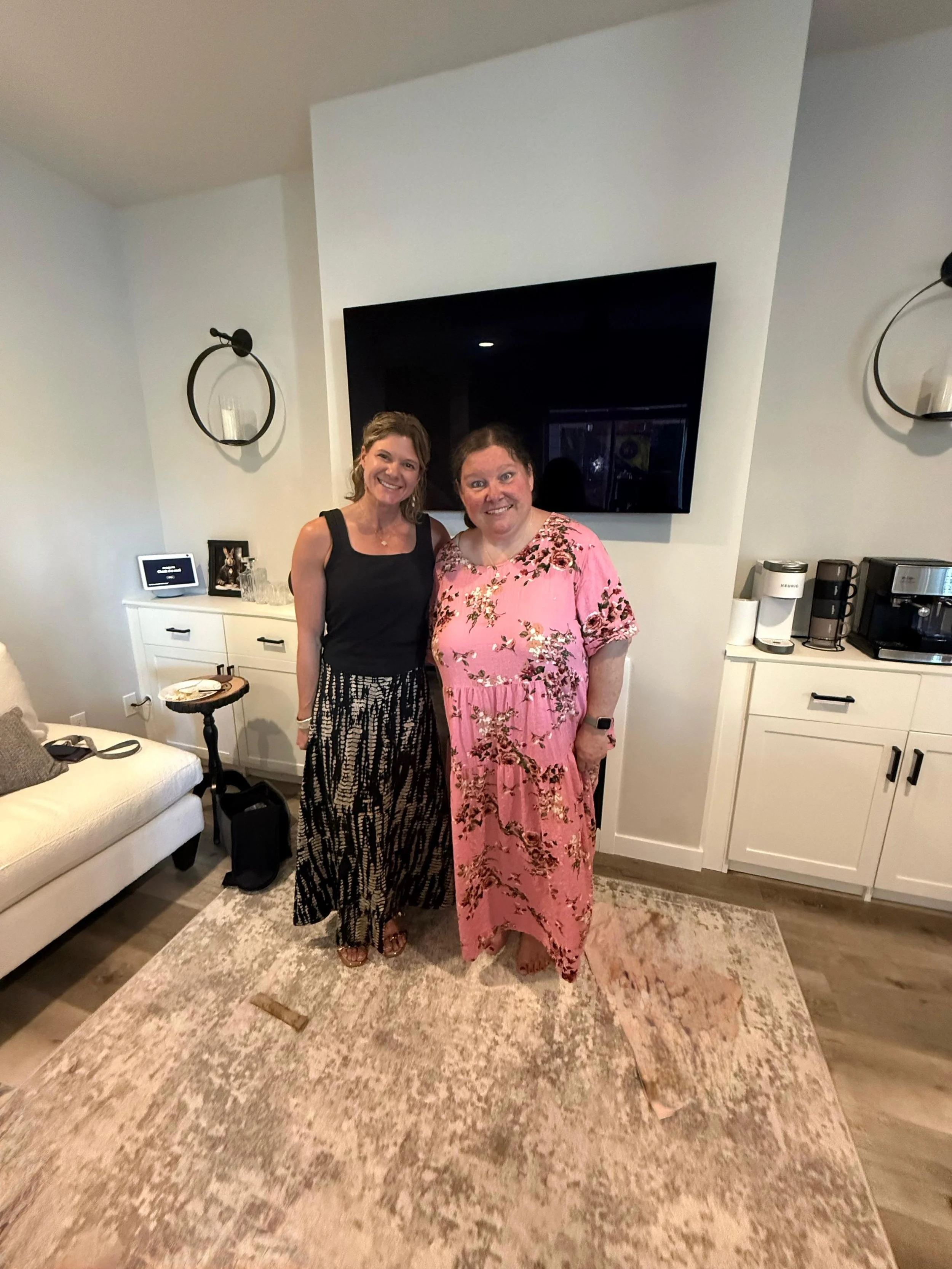Bobbi and real estate agent Rhonda at Davis Estates in Forest Grove, OR celebrating condo purchase near family with seeing-eye dog Bristol