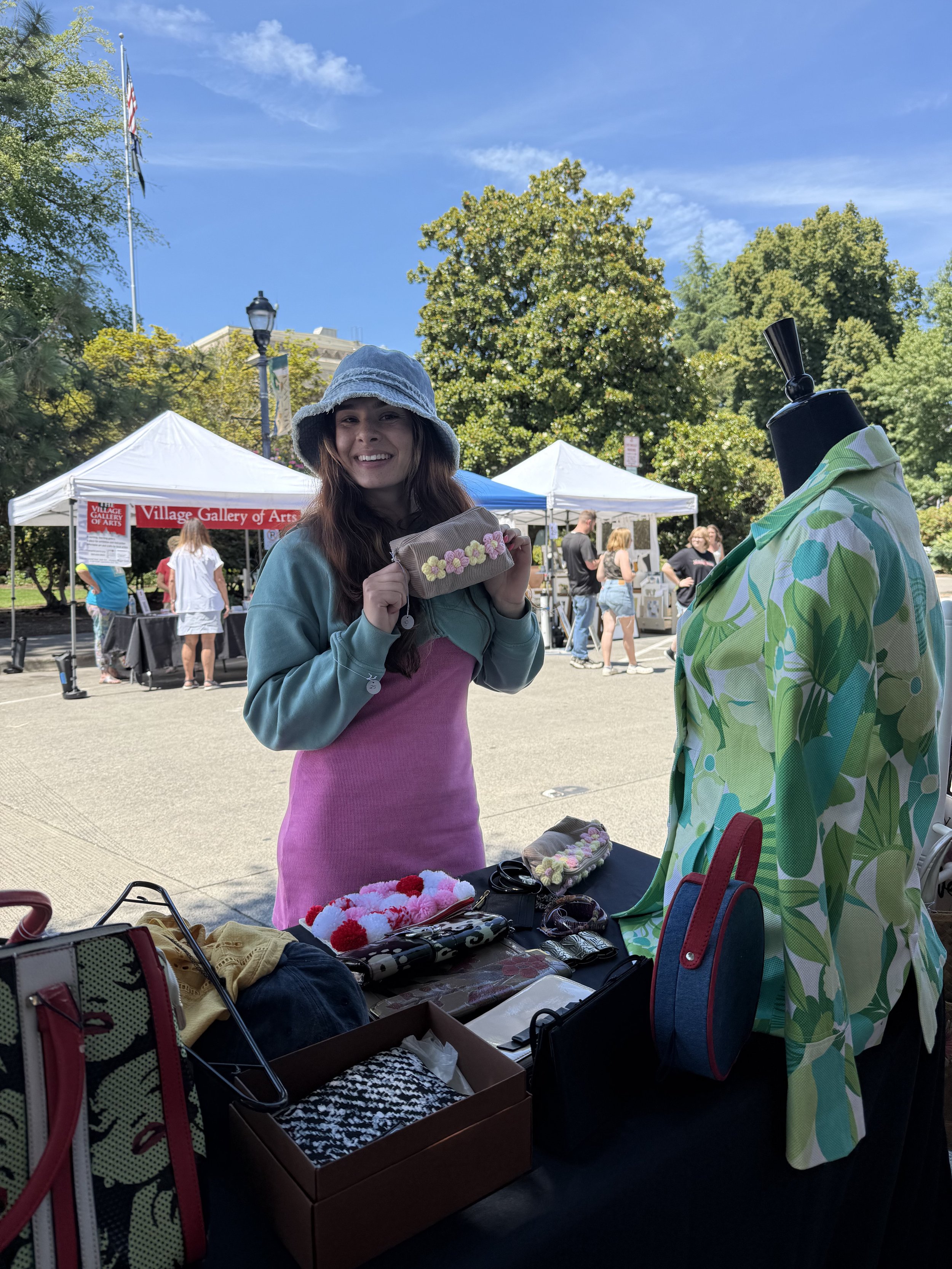 VIP client and friend celebrating at Portland’s Chalk Art Festival surrounded by colorful chalk art