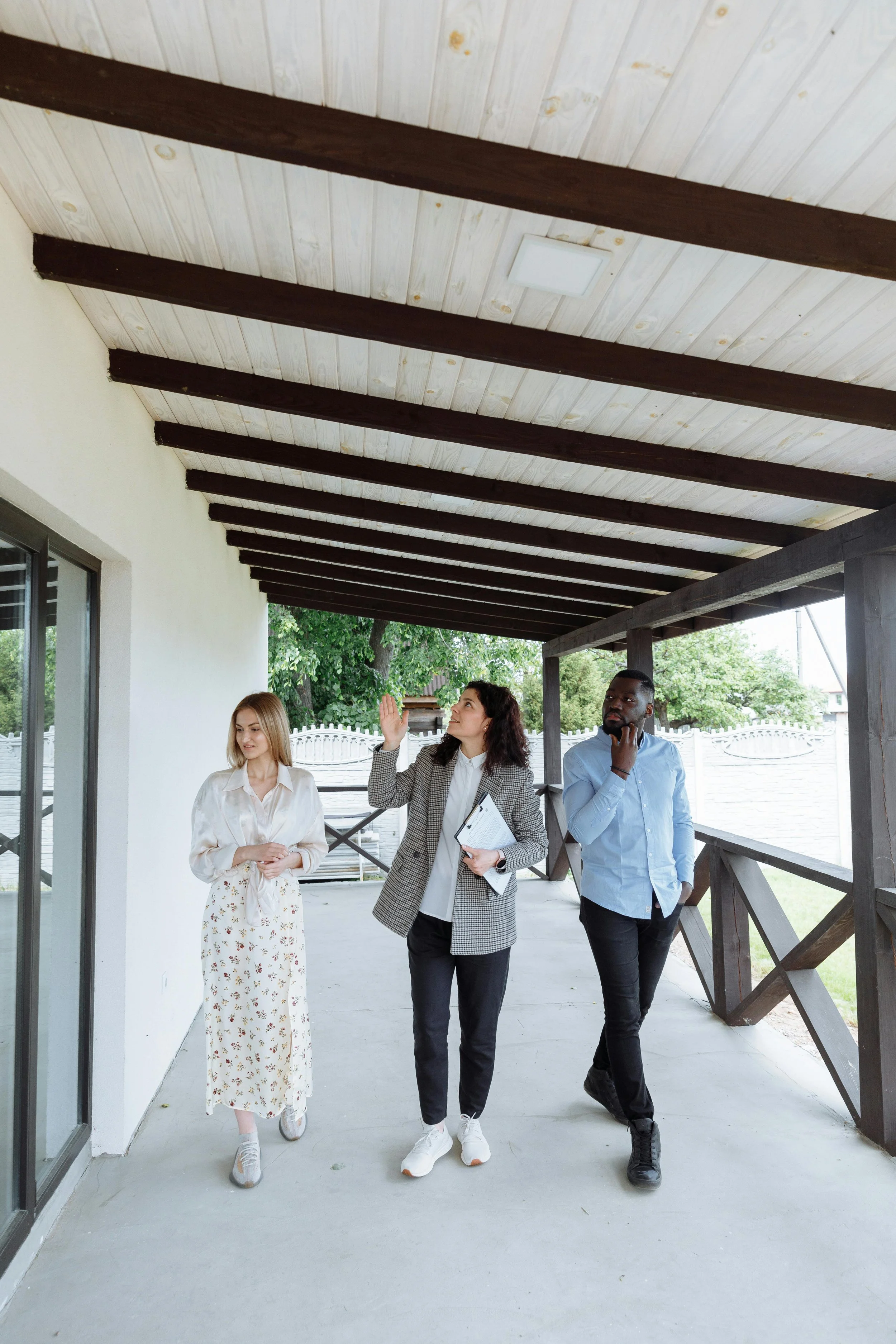 Homebuyers comparing different properties during a real estate tour in Beaverton Oregon
