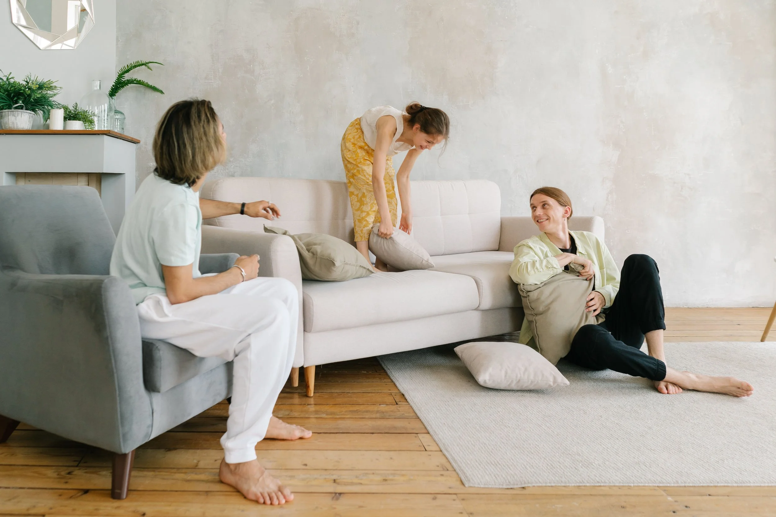 Family relaxing and playing in a bright, spacious living room in a Bethany home