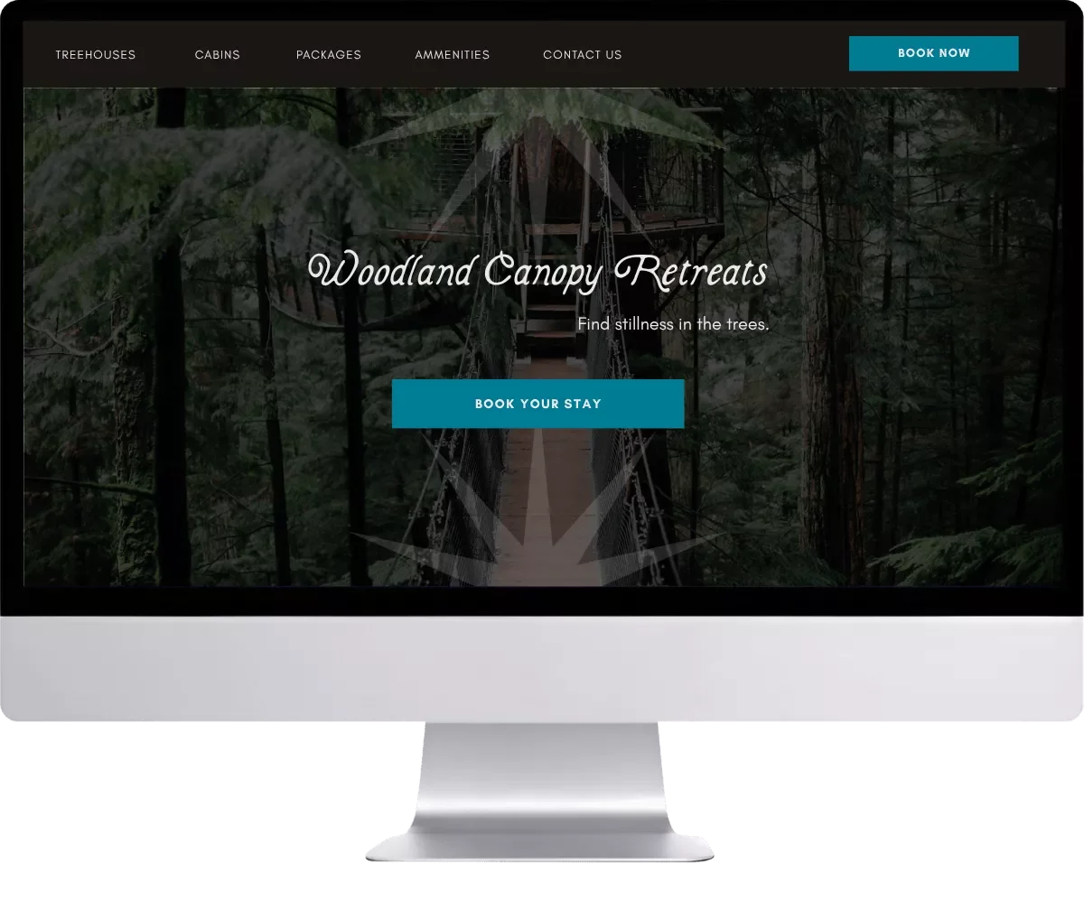 Mockup of Woodland Canopy Retreats website on desktop monitor.