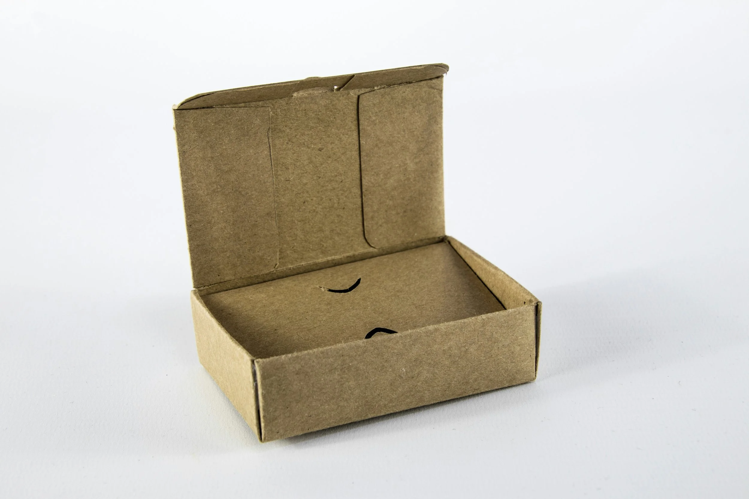 Open blank kraft cardboard mailer box on a white background.