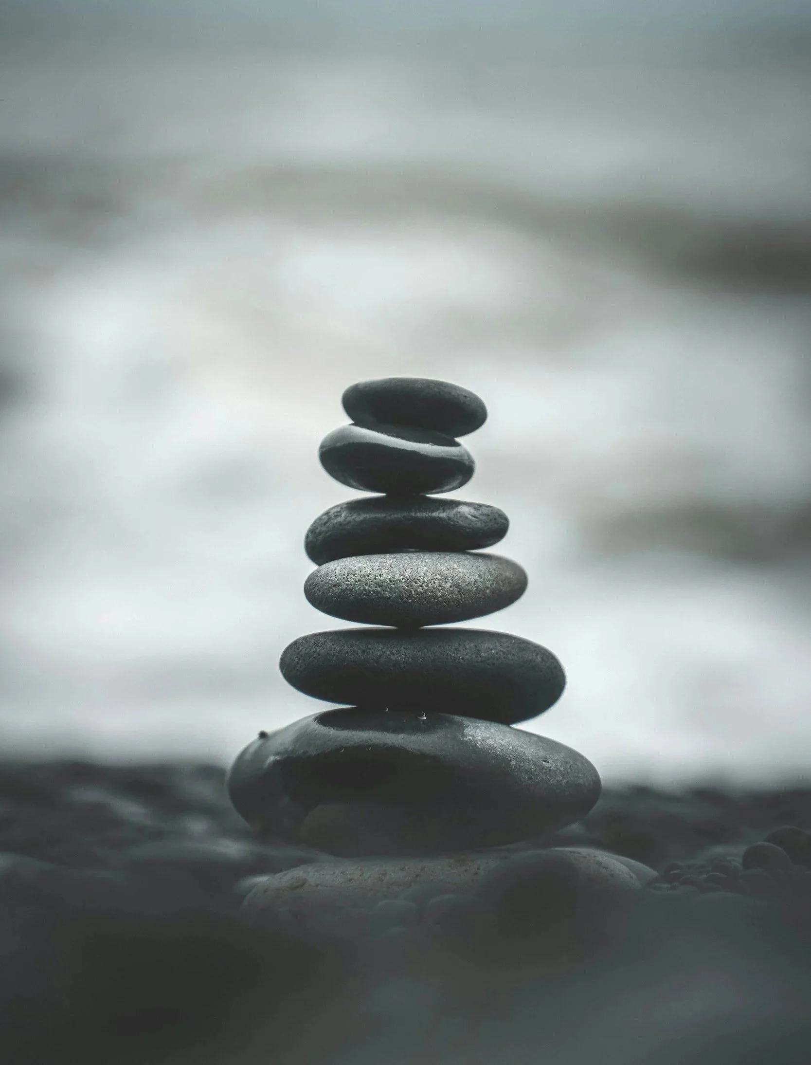 Rocks in perfect balance stacked in a pyramid
