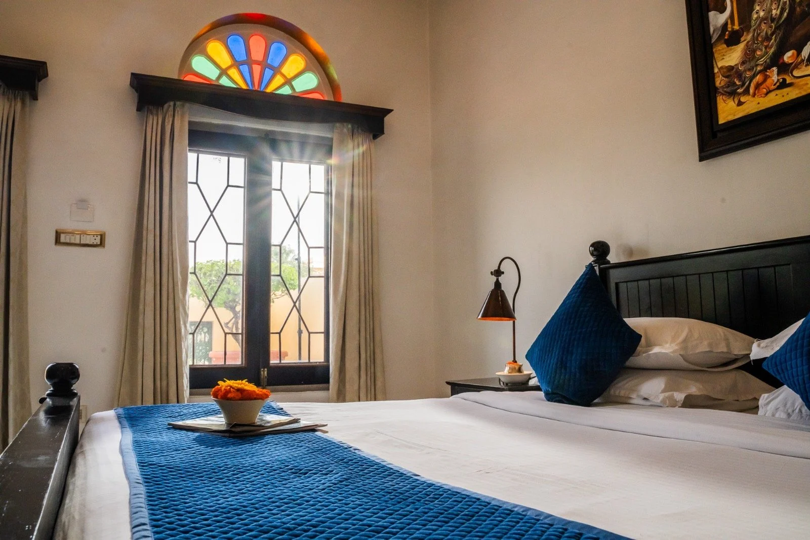 Heritage bedroom with stained glass window at Narain Niwas Palace hotel, Jaipur, Rajasthan-India with Bernadette