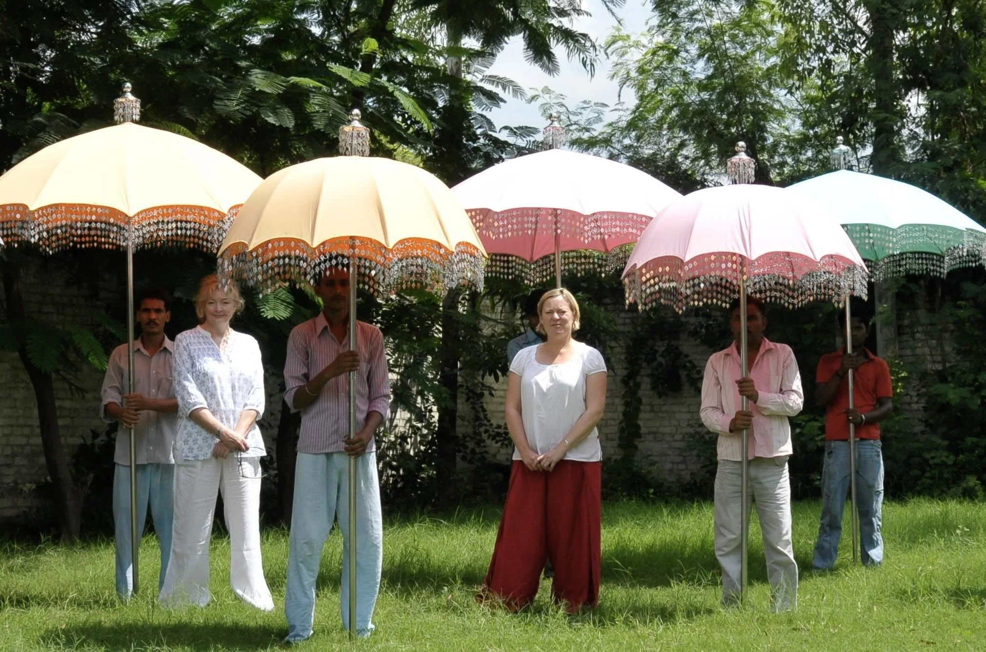 Indian Garden Company Raj umbrellas with steel poles, displayed by craftsmen and team during an early production phase in Kerala, India.
